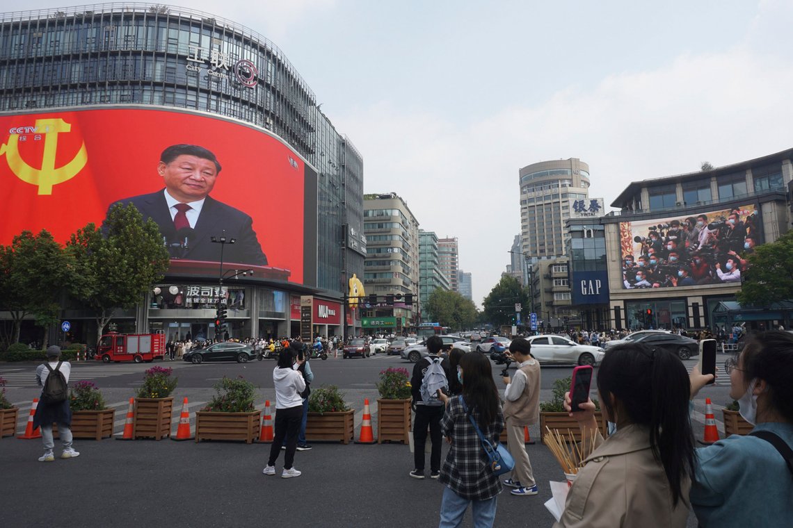 Chinese President Xi Jinping is seen at the end of the Chinese Communist Party's 20th Party Congress on a giant screen a commercial district of Hangzhou in eastern China's Zhejiang province on Sunday, Oct 23, 2022. China's economic growth accelerated in the latest quarter but still was among the slowest in decades as the country wrestled with repeated closures of cities to fight virus outbreaks. (Chinatopix via AP) Chinese President Xi Jinping is seen at the end of the Chinese Communist Party's 20th Party Congress on a giant screen a commercial district of Hangzhou in eastern China's Zhejiang province on Sunday, Oct 23, 2022. China's economic growth accelerated in the latest quarter but still was among the slowest in decades as the country wrestled with repeated closures of cities to fight virus outbreaks. (Chinatopix via AP)