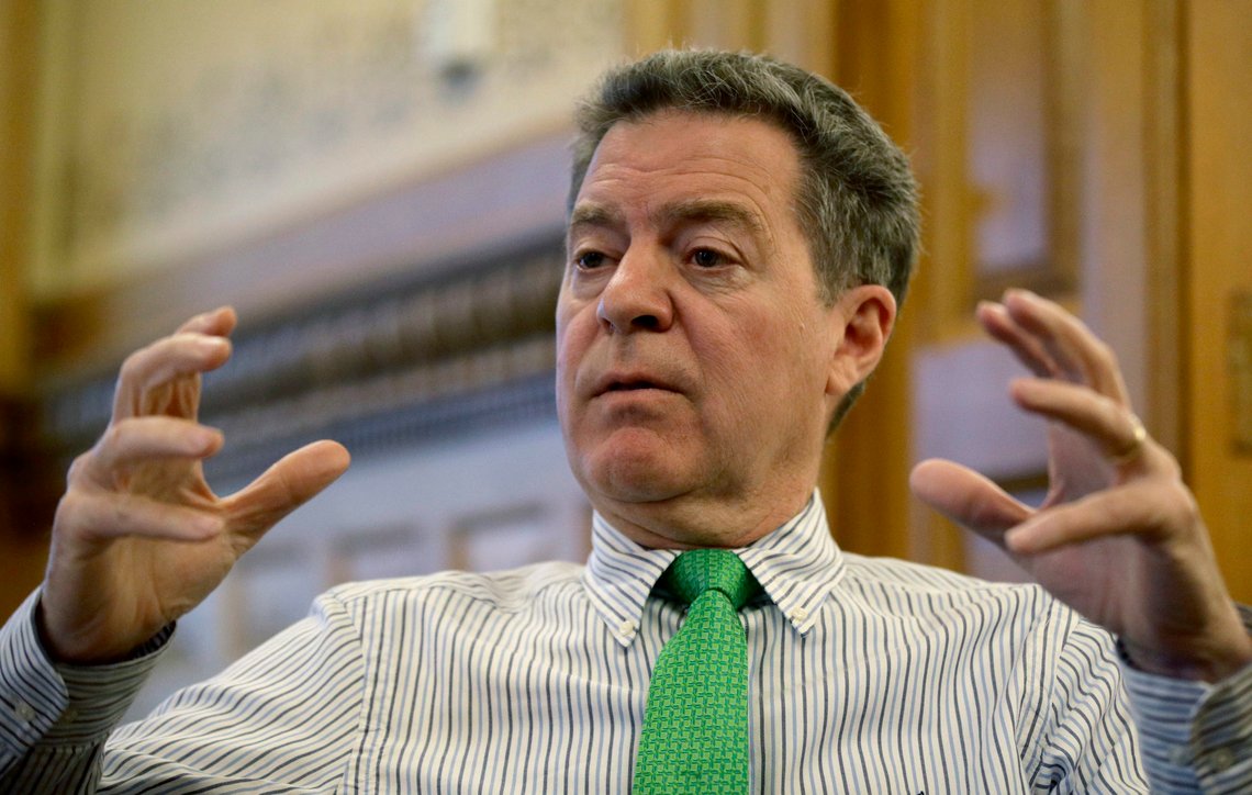 In this Tuesday, Dec. 19, 2017 photo, Kansas Gov. Sam Brownback talks about his term as governor during an interview at the Kansas Statehouse in Topeka, Kan. Brownback is awaiting U.S. Senate confirmation as ambassador-at-large for international religious freedom. (AP Photo/Charlie Riedel) In this Tuesday, Dec. 19, 2017 photo, Kansas Gov. Sam Brownback talks about his term as governor during an interview at the Kansas Statehouse in Topeka, Kan. Brownback is awaiting U.S. Senate confirmation as ambassador-at-large for international religious freedom. (AP Photo/Charlie Riedel)