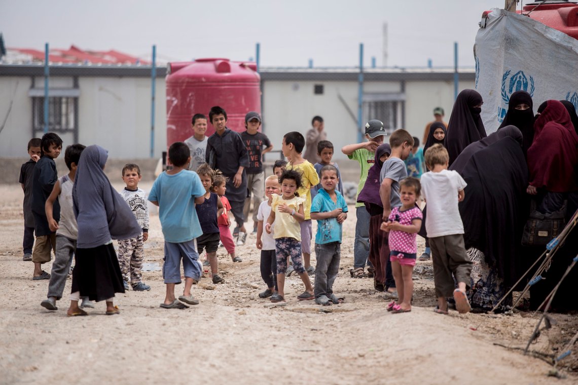 Women and children gather in front their tents at al-Hol camp that houses some 60,000 refugees, including families and supporters of the Islamic State group, many of them foreign nationals, in Hasakeh province, Syria, Saturday, May 1, 2021. Kurdish officials say security has improved at the sprawling camp in northeast Syria, but concerns are growing of a coronavirus outbreak in the facility. (AP Photo/Baderkhan Ahmad) Women and children gather in front their tents at al-Hol camp that houses some 60,000 refugees, including families and supporters of the Islamic State group, many of them foreign nationals, in Hasakeh province, Syria, Saturday, May 1, 2021. Kurdish officials say security has improved at the sprawling camp in northeast Syria, but concerns are growing of a coronavirus outbreak in the facility. (AP Photo/Baderkhan Ahmad)