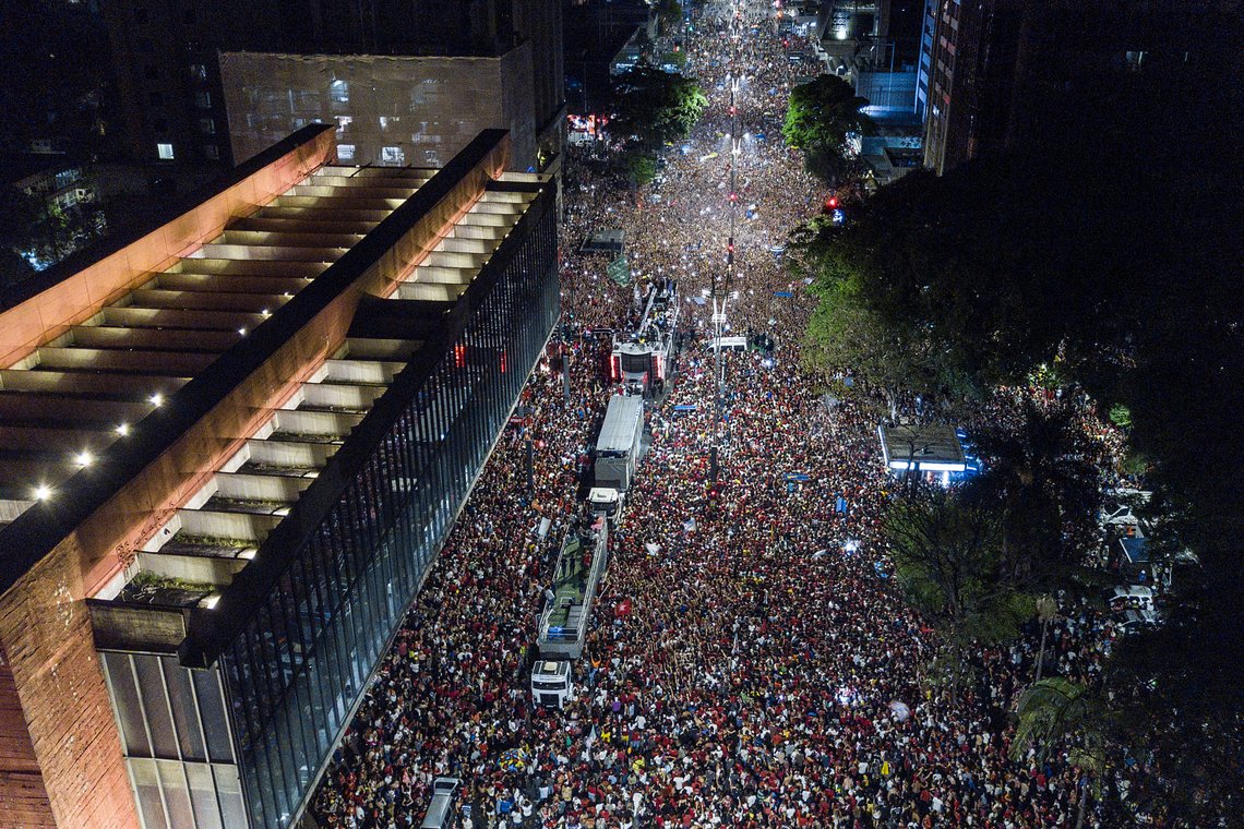 Supporters of former Brazilian President Luiz Inacio Lula gather on Paulista Av. after he defeated incumbent Jair Bolsonaro in a presidential run-off election to become the country's next president, in Sao Paulo, Brazil, Sunday, Oct. 30, 2022. (AP Photo/Matias Delacroix) Supporters of former Brazilian President Luiz Inacio Lula gather on Paulista Av. after he defeated incumbent Jair Bolsonaro in a presidential run-off election to become the country's next president, in Sao Paulo, Brazil, Sunday, Oct. 30, 2022. (AP Photo/Matias Delacroix)