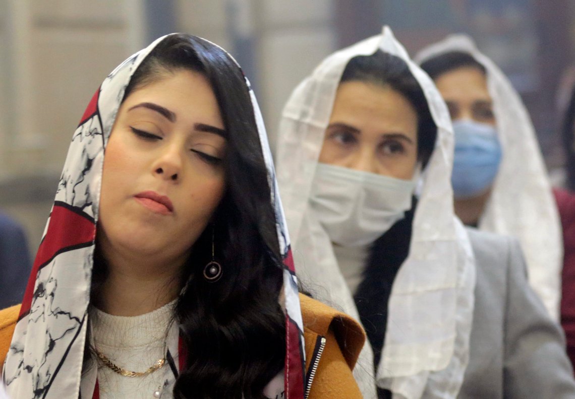 Egyptian Coptic Orthodox attend Midnight Mass on Orthodox Christmas Eve at Church of St. George in Cairo, Egypt, late Thursday, Jan. 6, 2022. Copts celebrate Christmas according to the Julian calendar, meaning it falls on Jan. 7. (AP Photo/Amr Nabil) Egyptian Coptic Orthodox attend Midnight Mass on Orthodox Christmas Eve at Church of St. George in Cairo, Egypt, late Thursday, Jan. 6, 2022. Copts celebrate Christmas according to the Julian calendar, meaning it falls on Jan. 7. (AP Photo/Amr Nabil)