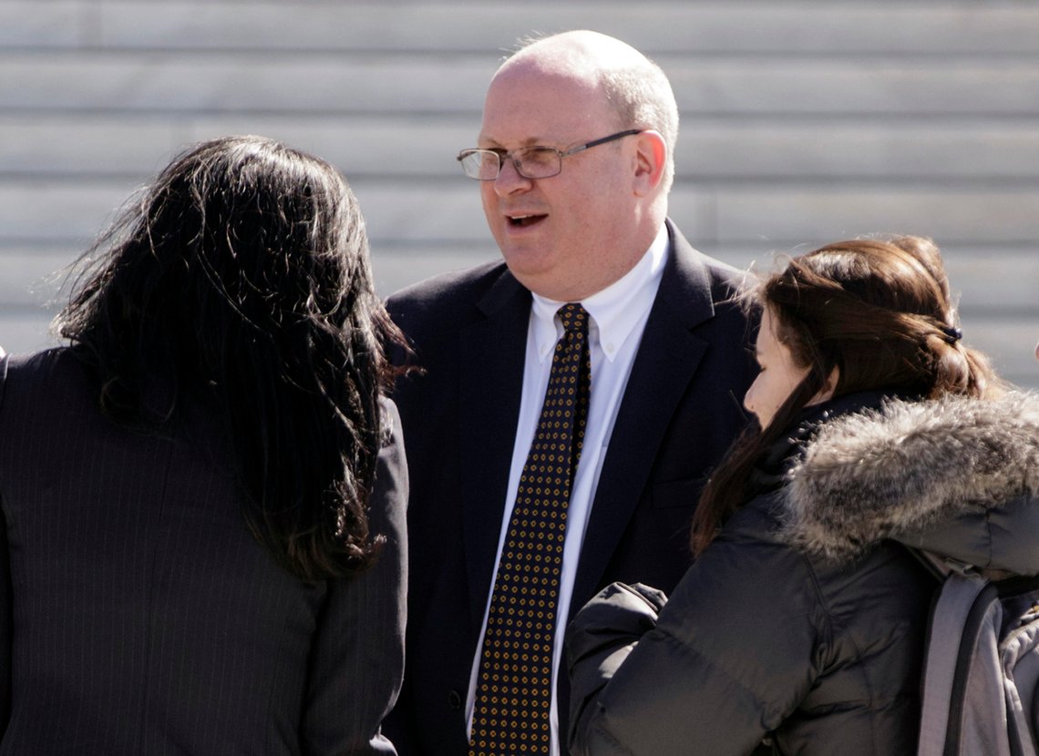 FILE - In this March 21, 2016, file photo, attorney Marc Elias, one of several lawyers who appeared in the in the case of Wittman v. Personhuballah, stands on the plaza of the Supreme Court in Washington. Hillary Clinton's presidential campaign and the Democratic National Committee helped fund a political research firm that produced a dossier of allegations about President Donald Trump's ties to Russia. That's according to a person familiar with the situation who spoke on Oct. 24, 2017, to The Associated Press. The person says the arrangement, first reported by The Washington Post, was coordinated by a lawyer for the campaign and the DNC and his law firm. That lawyer, Marc Elias, did not immediately return an email seeking comment. (AP Photo/J. Scott Applewhite) FILE - In this March 21, 2016, file photo, attorney Marc Elias, one of several lawyers who appeared in the in the case of Wittman v. Personhuballah, stands on the plaza of the Supreme Court in Washington. Hillary Clinton's presidential campaign and the Democratic National Committee helped fund a political research firm that produced a dossier of allegations about President Donald Trump's ties to Russia. That's according to a person familiar with the situation who spoke on Oct. 24, 2017, to The Associated Press. The person says the arrangement, first reported by The Washington Post, was coordinated by a lawyer for the campaign and the DNC and his law firm. That lawyer, Marc Elias, did not immediately return an email seeking comment. (AP Photo/J. Scott Applewhite)