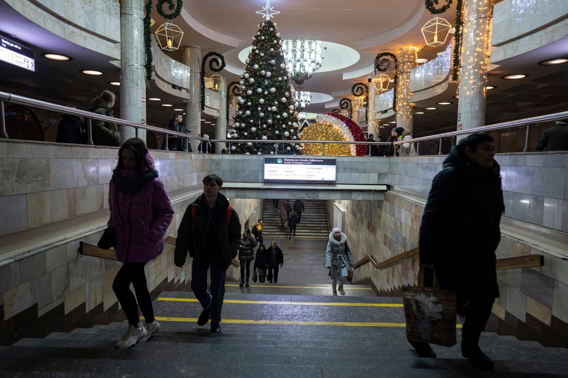 People walk to board a metro train at the "University" subway station decorated with a Christmas tree in Kharkiv, Ukraine, Wednesday, Dec. 21, 2022. (AP Photo/Evgeniy Maloletka) People walk to board a metro train at the "University" subway station decorated with a Christmas tree in Kharkiv, Ukraine, Wednesday, Dec. 21, 2022. (AP Photo/Evgeniy Maloletka)
