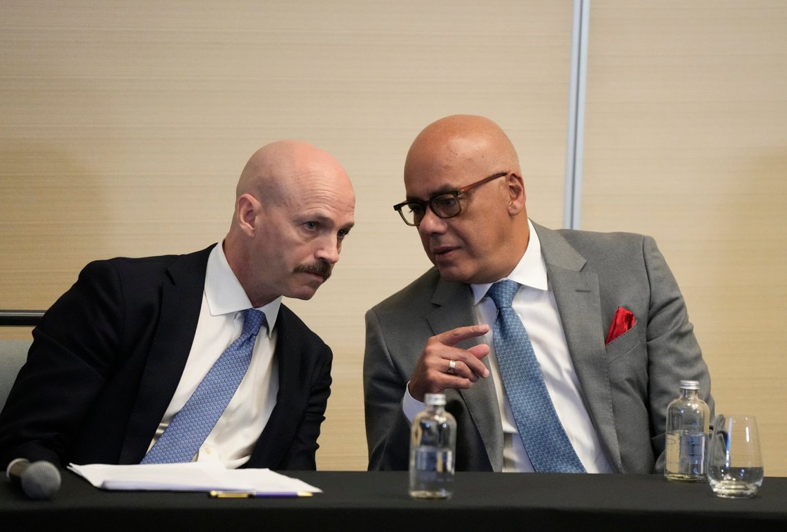 Norwegian diplomat Dag Nylander, left, and President of the National Assembly of Venezuela, Jorge Rodriguez, confer during a signing ceremony for an agreement to create a U.N.-managed fund to finance health, food and education programs for the poor during a ceremony at a hotel in Mexico City, Saturday, Nov. 26, 2022. The agreement signed by representatives of Venezuelan President Nicolás Maduro and the opposition marked the resumption of long-stalled negotiations meant to find a common path out of their country's complex crisis. The U.S. government, in response, agreed to allow oil giant Chevron to pump Venezuelan oil. (AP Photo/Fernando Llano) Norwegian diplomat Dag Nylander, left, and President of the National Assembly of Venezuela, Jorge Rodriguez, confer during a signing ceremony for an agreement to create a U.N.-managed fund to finance health, food and education programs for the poor during a ceremony at a hotel in Mexico City, Saturday, Nov. 26, 2022. The agreement signed by representatives of Venezuelan President Nicolás Maduro and the opposition marked the resumption of long-stalled negotiations meant to find a common path out of their country's complex crisis. The U.S. government, in response, agreed to allow oil giant Chevron to pump Venezuelan oil. (AP Photo/Fernando Llano)