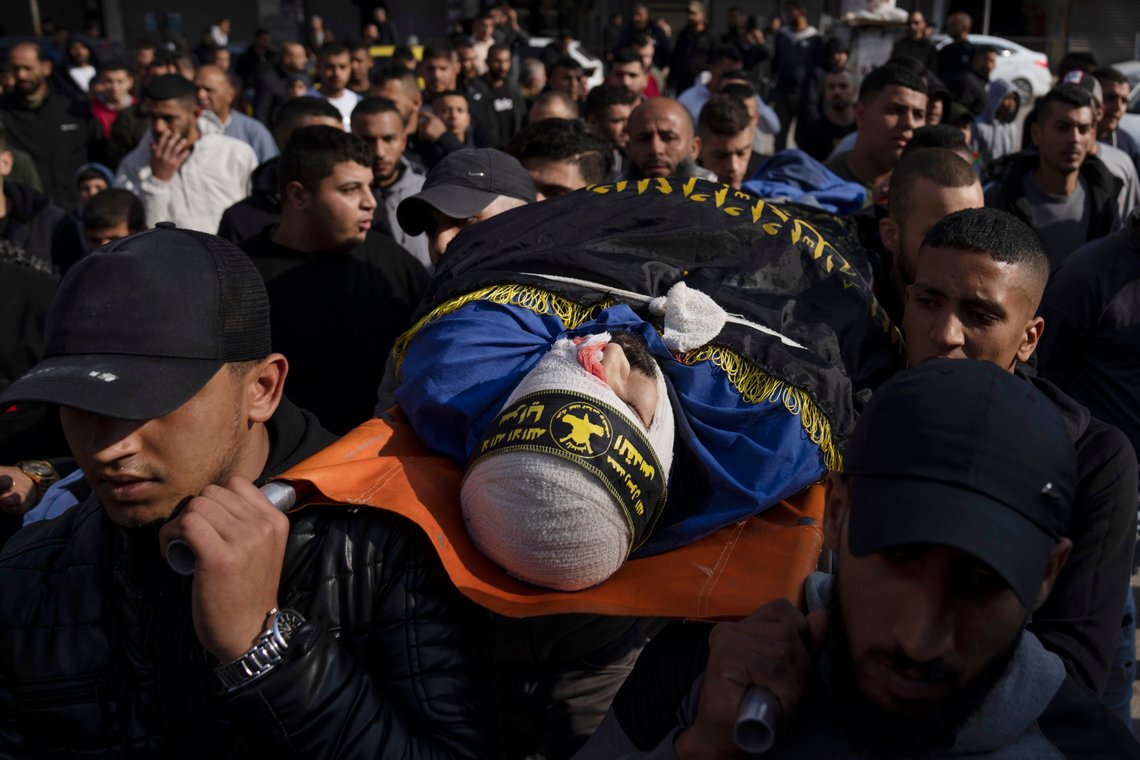 Mourners carry the body of Tarek al-Damj during his funeral in the West Bank city of Jenin, Thursday, Dec. 8, 2022. Israeli forces killed Palestinians Atta Shalabi, Tarek al-Damj, and Sedki Zakarneh, during an early Thursday raid in the occupied West Bank, the Palestinian Health Ministry said, the latest violence to shake the region after months of unrest. (AP Photo/Nasser Nasser) Mourners carry the body of Tarek al-Damj during his funeral in the West Bank city of Jenin, Thursday, Dec. 8, 2022. Israeli forces killed Palestinians Atta Shalabi, Tarek al-Damj, and Sedki Zakarneh, during an early Thursday raid in the occupied West Bank, the Palestinian Health Ministry said, the latest violence to shake the region after months of unrest. (AP Photo/Nasser Nasser)