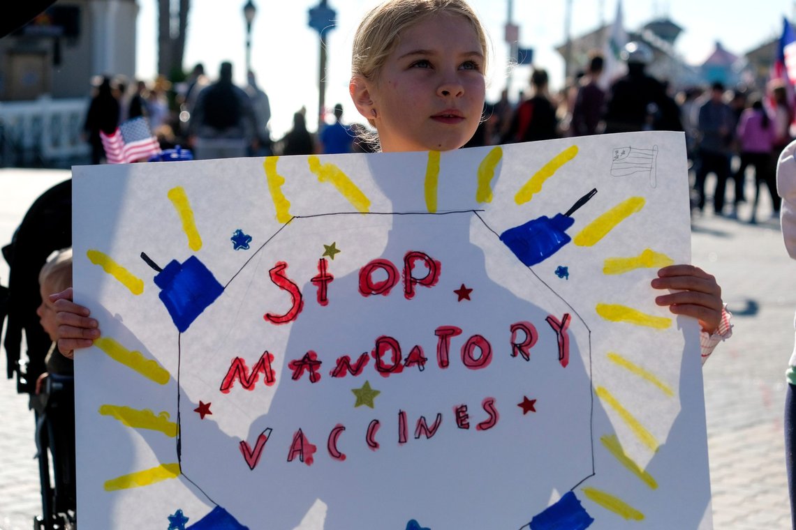People protest against ``"Bad Bills'' expected to be considered by state legislatures in the coming year, including COVID vaccine mandates for students and wrorkers in Huntington Beach, Jan. 3, 2022. Photo: Shutterstock, Ringo Chiu, United States People protest against ``"Bad Bills'' expected to be considered by state legislatures in the coming year, including COVID vaccine mandates for students and wrorkers in Huntington Beach, Jan. 3, 2022. Photo: Shutterstock, Ringo Chiu, United States