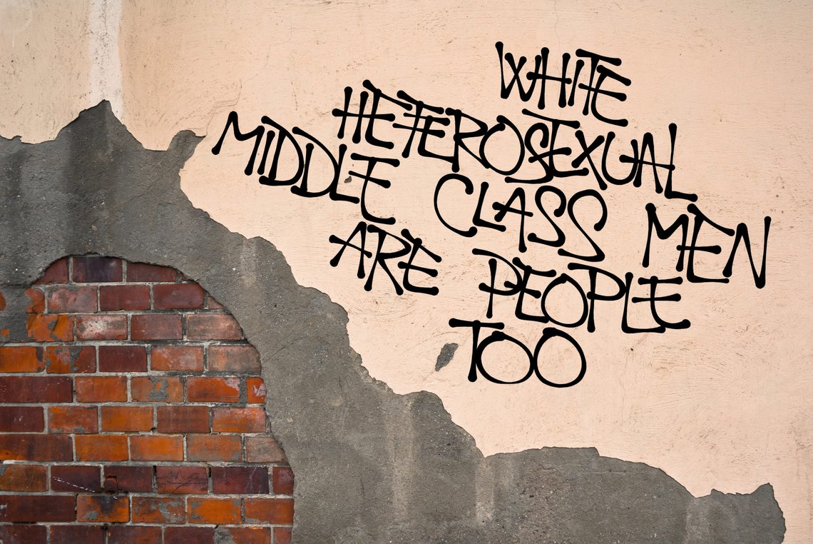 White Heterosexual Middle Class Are People Too - handwritten graffiti sprayed on the wall - fight against unfair discrimination, neglect and attack on cisgender and rich males because of privilege. Photo: Shutterstock, M-SUR,Czech Republic White Heterosexual Middle Class Are People Too - handwritten graffiti sprayed on the wall - fight against unfair discrimination, neglect and attack on cisgender and rich males because of privilege. Photo: Shutterstock, M-SUR,Czech Republic