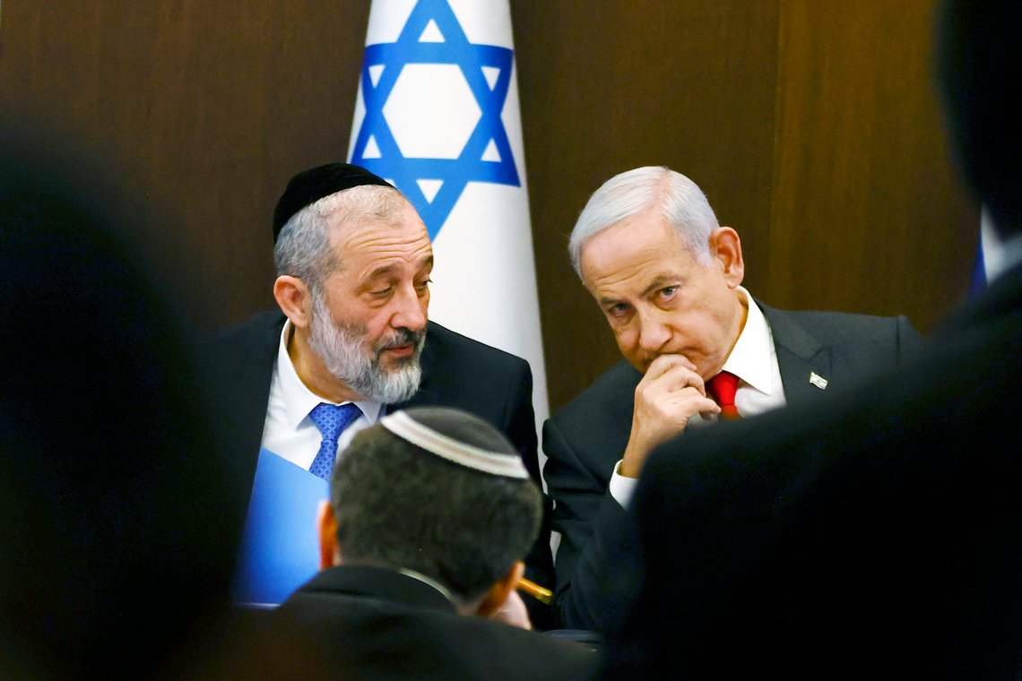 Israeli Prime Minister Benjamin Netanyahu, right, speaks with Interior and Health Minister Aryeh Deri at a weekly cabinet meeting at the Prime Minister's office in Jerusalem, Sunday, Jan. 8, 2023. (Ronen Zvulun/Pool Photo via AP) Israeli Prime Minister Benjamin Netanyahu, right, speaks with Interior and Health Minister Aryeh Deri at a weekly cabinet meeting at the Prime Minister's office in Jerusalem, Sunday, Jan. 8, 2023. (Ronen Zvulun/Pool Photo via AP)