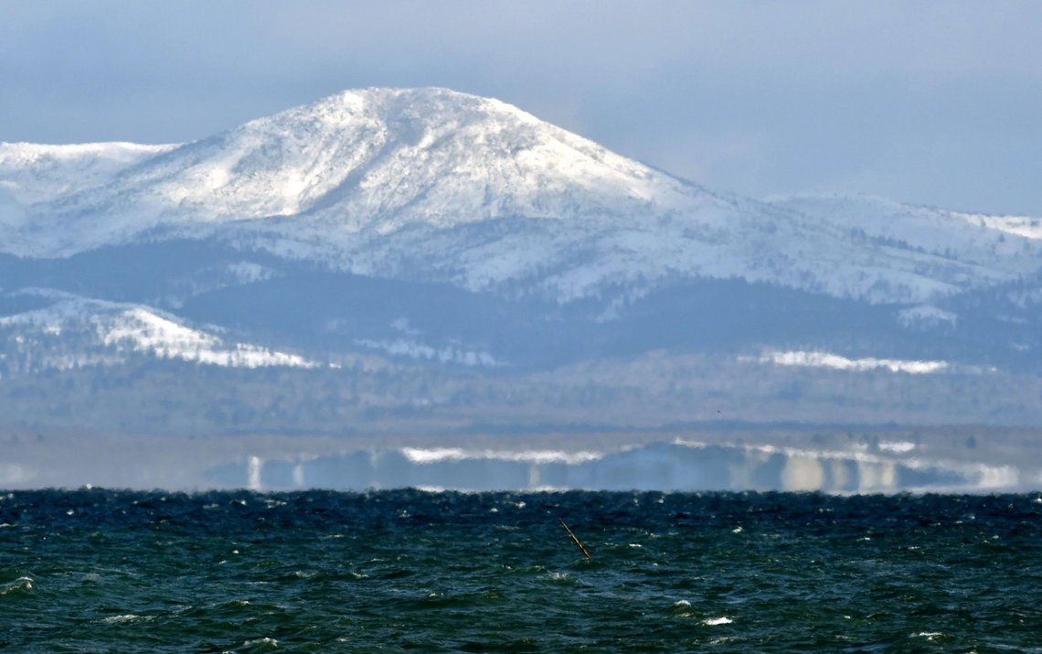 Kunashiri Island, one of four southern Kuril islands, which Japan calls the Northern Territories, is seen from the Notsuke Peninsula in Betsukai in Japan's northernmost major island of Hokkaido Thursday, Dec. 15, 2016. Russian President Vladimir Putin arrived in Japan on Thursday for a two-day summit that marks his first official visit to a G-7 country since Russia's 2014 annexation of Crimea. During two days of talks, Japan's Prime Minister Shinzo Abe hopes to make progress on a long-running territorial dispute over the four islands, while trying to bolster ties with economic projects. Japanese on the board reads: "Kunashiri, the island close but far." (Yoshiaki Sakamoto/Kyodo News via AP) Kunashiri Island, one of four southern Kuril islands, which Japan calls the Northern Territories, is seen from the Notsuke Peninsula in Betsukai in Japan's northernmost major island of Hokkaido Thursday, Dec. 15, 2016. Russian President Vladimir Putin arrived in Japan on Thursday for a two-day summit that marks his first official visit to a G-7 country since Russia's 2014 annexation of Crimea. During two days of talks, Japan's Prime Minister Shinzo Abe hopes to make progress on a long-running territorial dispute over the four islands, while trying to bolster ties with economic projects. Japanese on the board reads: "Kunashiri, the island close but far." (Yoshiaki Sakamoto/Kyodo News via AP)