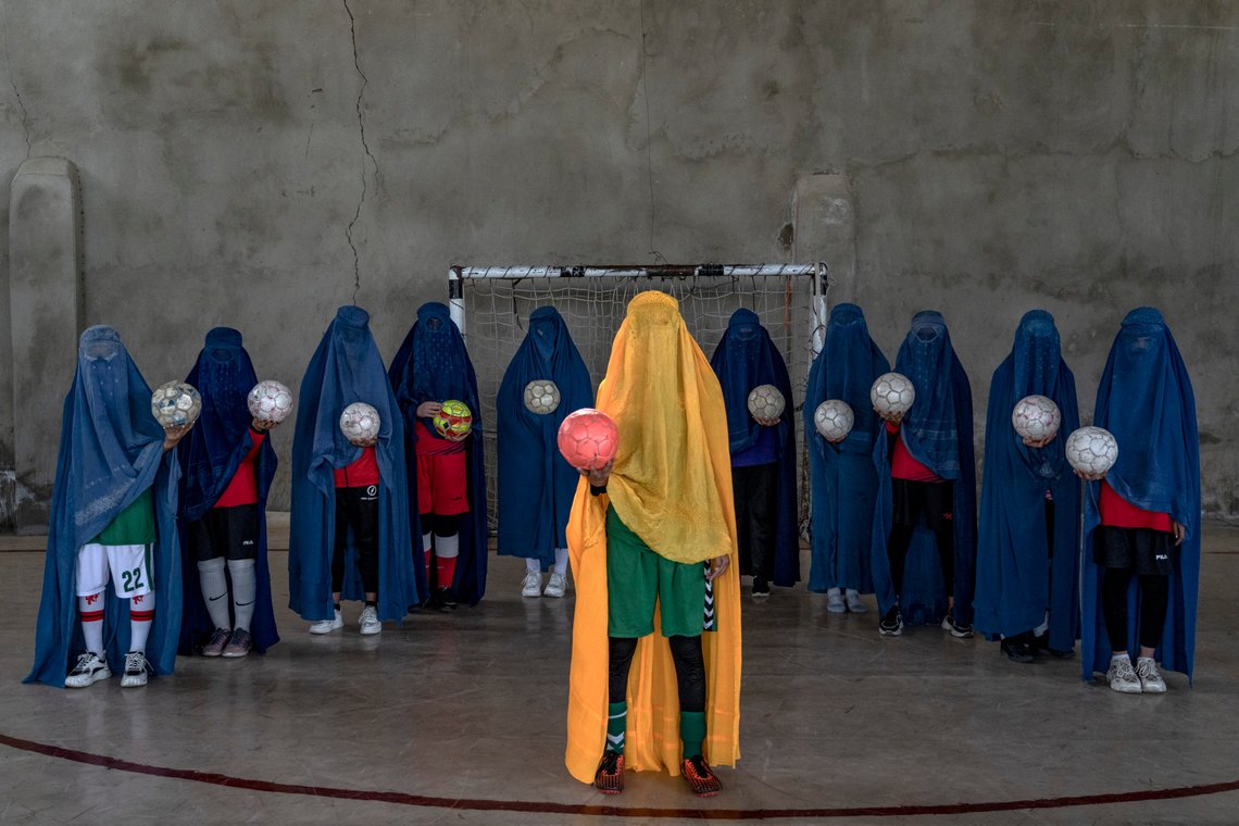 An Afghan women's soccer team poses for a photo in Kabul, Afghanistan, Thursday, Sept. 22, 2022. The ruling Taliban have banned women from sports as well as barring them from most schooling and many realms of work. A number of women posed for an AP photographer for portraits with the equipment of the sports they loved. Though they do not necessarily wear the burqa in regular life, they chose to hide their identities with their burqas because they fear Taliban reprisals and because some of them continue to practice their sports in secret. (AP Photo/Ebrahim Noroozi) An Afghan women's soccer team poses for a photo in Kabul, Afghanistan, Thursday, Sept. 22, 2022. The ruling Taliban have banned women from sports as well as barring them from most schooling and many realms of work. A number of women posed for an AP photographer for portraits with the equipment of the sports they loved. Though they do not necessarily wear the burqa in regular life, they chose to hide their identities with their burqas because they fear Taliban reprisals and because some of them continue to practice their sports in secret. (AP Photo/Ebrahim Noroozi)