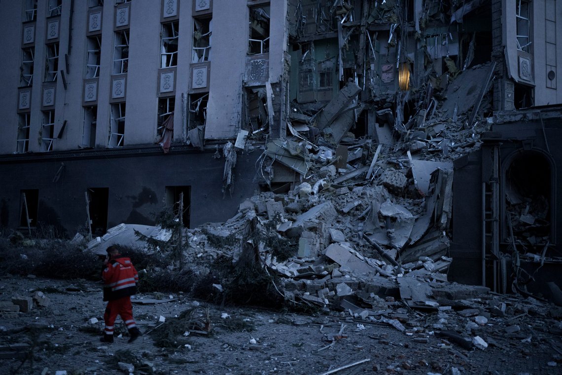 An emergency worker walks in front of a damaged hotel following a Russian attack in Kyiv, Ukraine, Saturday, Dec. 31, 2022. (AP Photo/Felipe Dana) An emergency worker walks in front of a damaged hotel following a Russian attack in Kyiv, Ukraine, Saturday, Dec. 31, 2022. (AP Photo/Felipe Dana)