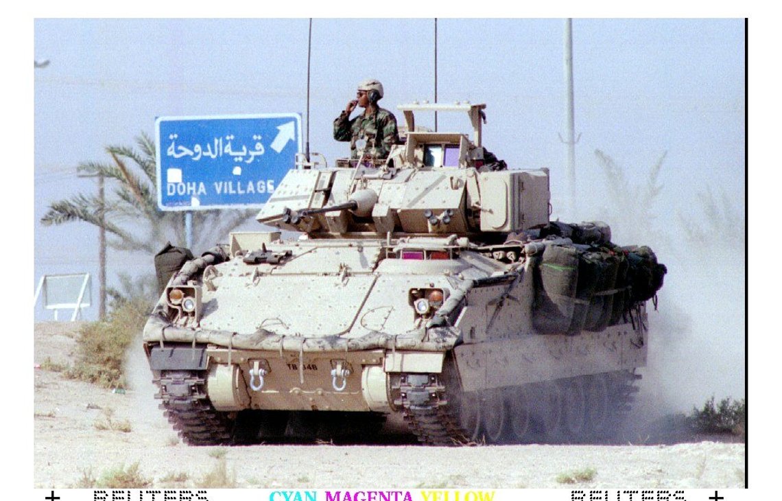 KUW13:IRAQ-KUWAIT:KUWAIT,11OCT94 - A U.S. Army Bradley Armoured Personell Carrier storms through Kuwait towards the military zone October 11. U.S. troops started moving their pre positioned equipment towards the desert to deter a threatened Iraqi attack against Kuwait. kc/Kevin Coombs REUTER KUW13:IRAQ-KUWAIT:KUWAIT,11OCT94 - A U.S. Army Bradley Armoured Personell Carrier storms through Kuwait towards the military zone October 11. U.S. troops started moving their pre positioned equipment towards the desert to deter a threatened Iraqi attack against Kuwait. kc/Kevin Coombs REUTER