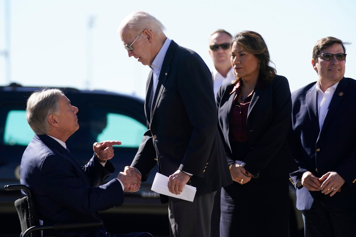 President Joe Biden shakes hands with Texas Gov. Greg Abbott after Abbott handed him a letter about the border at El Paso International Airport in El Paso Texas, Sunday, Jan. 8, 2023. Rep. Veronica Escobar, D-Texas, second from left, and Rep. Vicente Gonzalez Jr., D-Texas, right, look on. (AP Photo/Andrew Harnik) President Joe Biden shakes hands with Texas Gov. Greg Abbott after Abbott handed him a letter about the border at El Paso International Airport in El Paso Texas, Sunday, Jan. 8, 2023. Rep. Veronica Escobar, D-Texas, second from left, and Rep. Vicente Gonzalez Jr., D-Texas, right, look on. (AP Photo/Andrew Harnik)