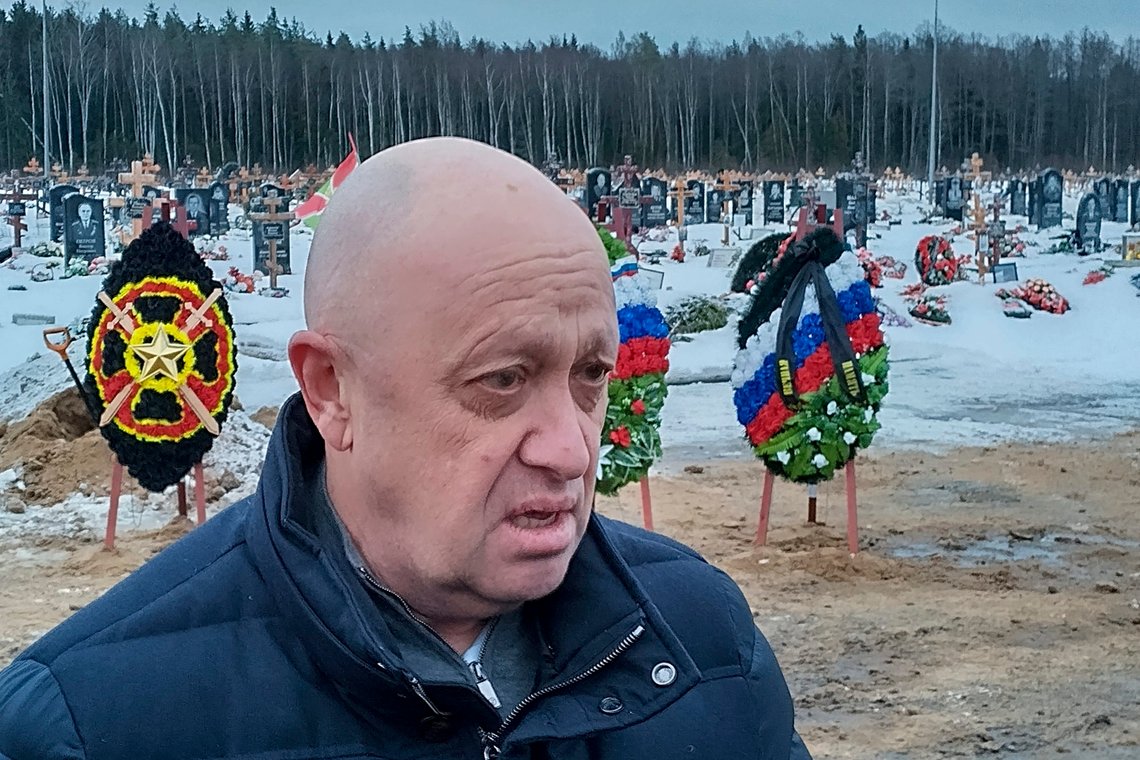 FILE - Wagner Group head Yevgeny Prigozhin attends the funeral of Dmitry Menshikov, a fighter of the Wagner group who died during a special operation in Ukraine, at the Beloostrovskoye cemetery outside St. Petersburg, Russia, Saturday, Dec. 24, 2022. The fighting for Soledar and Bakhmut again highlighted a bitter rift between the top military brass and Yevgeny Prigozhin, a rogue millionaire whose Wagner Group military contractor has played an increasing role in Ukraine. (AP Photo, File) FILE - Wagner Group head Yevgeny Prigozhin attends the funeral of Dmitry Menshikov, a fighter of the Wagner group who died during a special operation in Ukraine, at the Beloostrovskoye cemetery outside St. Petersburg, Russia, Saturday, Dec. 24, 2022. The fighting for Soledar and Bakhmut again highlighted a bitter rift between the top military brass and Yevgeny Prigozhin, a rogue millionaire whose Wagner Group military contractor has played an increasing role in Ukraine. (AP Photo, File)