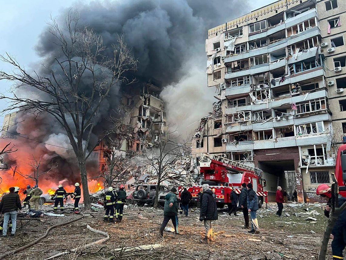 In this photo released by the Ukrainian Presidential Press Office, smoke rises after a Russian rocket hit a multistory building leaving many people under debris in Dnipro, Ukraine, Saturday, Jan. 14, 2023. (Ukrainian Presidential Press Office via AP) In this photo released by the Ukrainian Presidential Press Office, smoke rises after a Russian rocket hit a multistory building leaving many people under debris in Dnipro, Ukraine, Saturday, Jan. 14, 2023. (Ukrainian Presidential Press Office via AP)