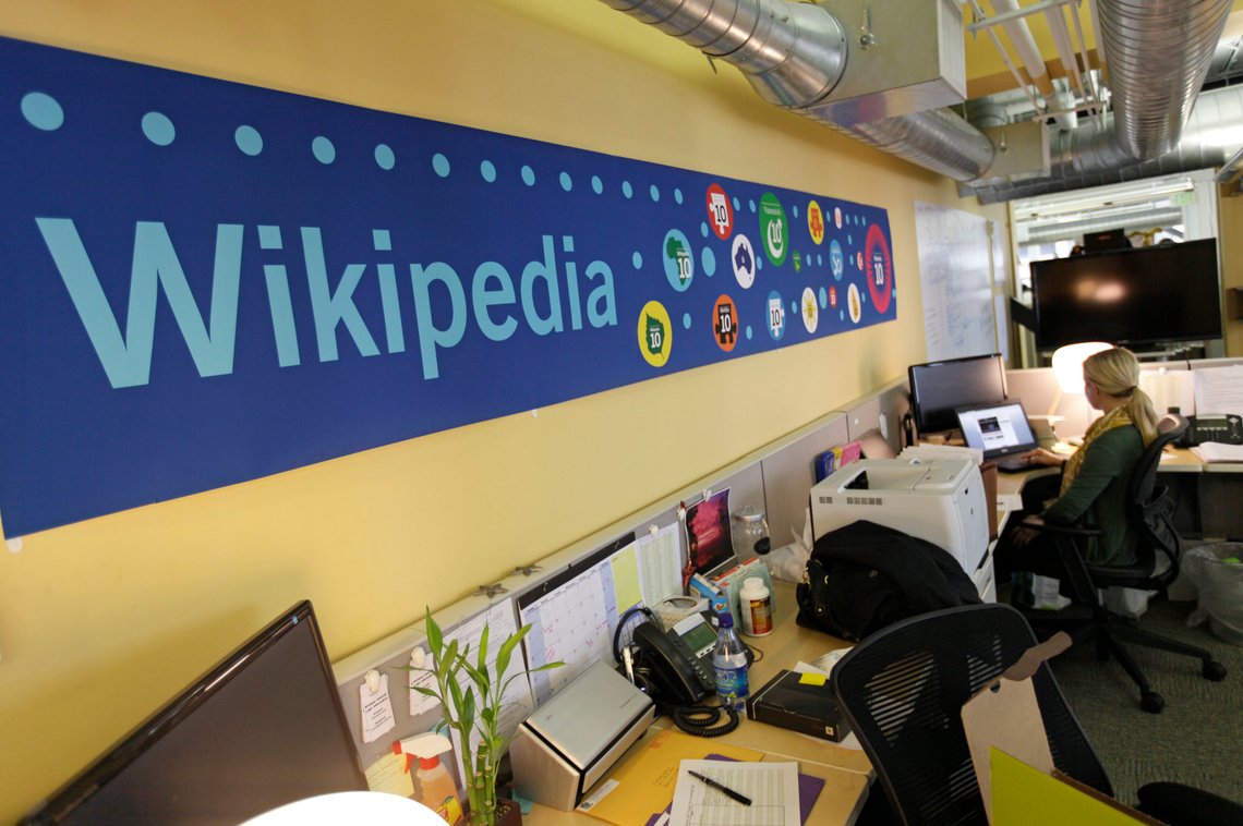 FILE - In this Jan. 18, 2012, file photo, Mallory Whitt works at her desk at the offices of the Wikipedia Foundation in San Francisco. The foundation announced on Jan. 26, 2017, that Craigslist founder Craig Newmark is donating $500,000 to help curb harassment on Wikipedia. (AP Photo/Eric Risberg, File) FILE - In this Jan. 18, 2012, file photo, Mallory Whitt works at her desk at the offices of the Wikipedia Foundation in San Francisco. The foundation announced on Jan. 26, 2017, that Craigslist founder Craig Newmark is donating $500,000 to help curb harassment on Wikipedia. (AP Photo/Eric Risberg, File)