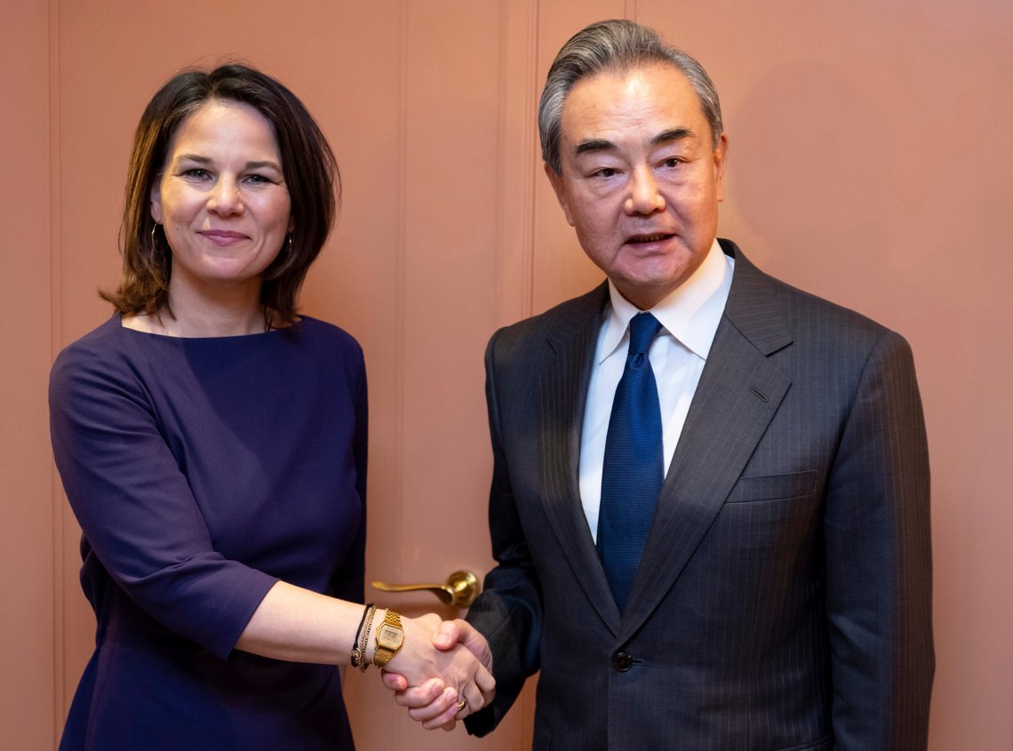 German Foreign Minister Annalena Baerbock, left, shakes hands with China's Director of the Office of the Central Foreign Affairs Commission Wang Yi for a bilateral meeting at the Munich Security Conference in Munich, Germany, Friday, Feb. 17, 2023. The 59th Munich Security Conference (MSC) takes place from Feb. 17 to Feb. 19, 2023 at the Bayerischer Hof Hotel in Munich. (Sven Hopee/Pool Photo via AP) German Foreign Minister Annalena Baerbock, left, shakes hands with China's Director of the Office of the Central Foreign Affairs Commission Wang Yi for a bilateral meeting at the Munich Security Conference in Munich, Germany, Friday, Feb. 17, 2023. The 59th Munich Security Conference (MSC) takes place from Feb. 17 to Feb. 19, 2023 at the Bayerischer Hof Hotel in Munich. (Sven Hopee/Pool Photo via AP)