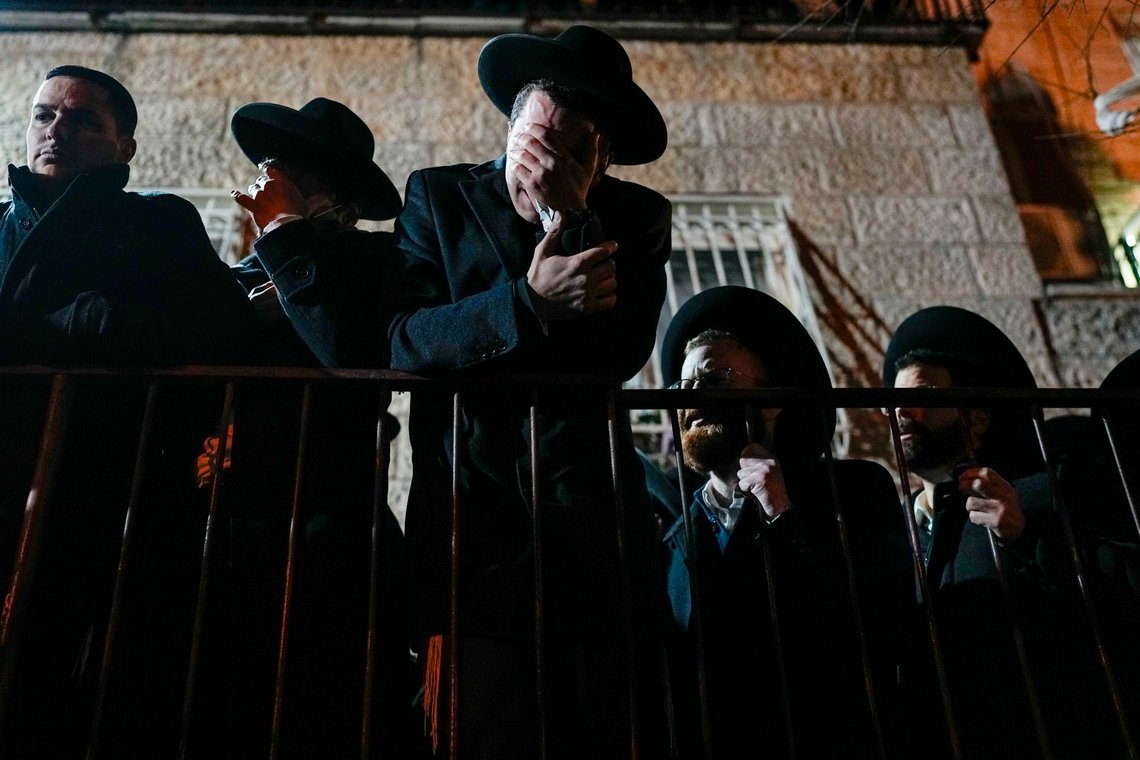 Ultra-Orthodox Jews mourn during the funeral of 8-year-old child Asher Menahem Paley after he died of injuries suffered a day before in a car-ramming attack by a Palestinian man during his funeral in Jerusalem, Saturday, Feb. 11, 2023. A Palestinian man plowed a car into a crowded bus stop in east Jerusalem on Friday, killing two more people, including Paley's six-year-old brother, and injuring five others before being shot and killed, Israeli police said. (AP Photo/Ohad Zwigenberg) Ultra-Orthodox Jews mourn during the funeral of 8-year-old child Asher Menahem Paley after he died of injuries suffered a day before in a car-ramming attack by a Palestinian man during his funeral in Jerusalem, Saturday, Feb. 11, 2023. A Palestinian man plowed a car into a crowded bus stop in east Jerusalem on Friday, killing two more people, including Paley's six-year-old brother, and injuring five others before being shot and killed, Israeli police said. (AP Photo/Ohad Zwigenberg)
