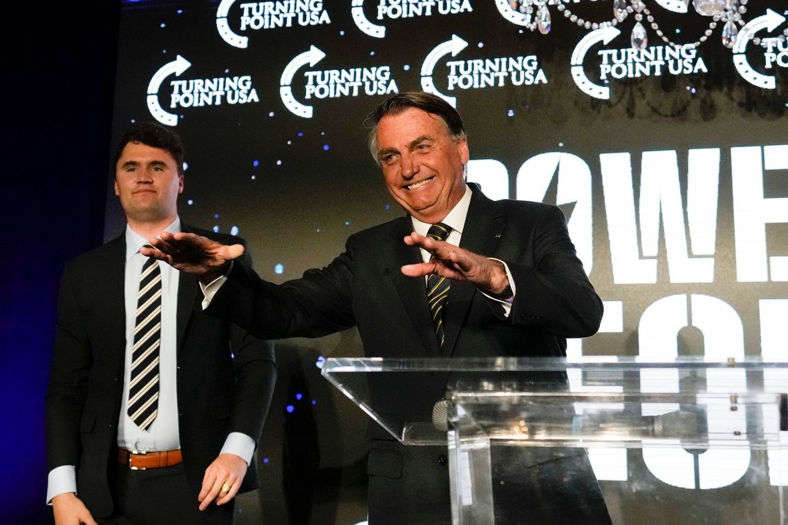 Brazil's right wing former President Jair Bolsonaro, right, speaks alongside Turning Point USA founder Charlie Kirk, at a TPUSA event at Trump National Doral Miami, Friday, Feb. 3, 2023, in Doral, Fla. (AP Photo/Rebecca Blackwell) Brazil's right wing former President Jair Bolsonaro, right, speaks alongside Turning Point USA founder Charlie Kirk, at a TPUSA event at Trump National Doral Miami, Friday, Feb. 3, 2023, in Doral, Fla. (AP Photo/Rebecca Blackwell)