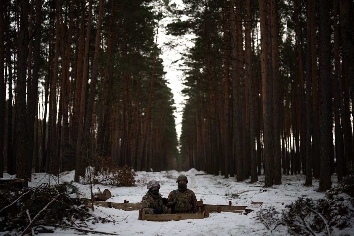 Ukrainian servicemen stand at a position close to the border with Belarus, Ukraine, Wednesday, Feb. 1, 2023. Reconnaissance drones fly several times a day from Ukrainian positions across the border into Belarus, a close Russian ally, scouring for signs of trouble on the other side. Ukrainian units are monitoring the 1,000-kilometer (650-mile) frontier of marsh and woodland for a possible surprise offensive from the north, a repeat of the unsuccessful Russian thrust towards Kyiv at the start of the war nearly a year ago. (AP Photo/Daniel Cole) Ukrainian servicemen stand at a position close to the border with Belarus, Ukraine, Wednesday, Feb. 1, 2023. Reconnaissance drones fly several times a day from Ukrainian positions across the border into Belarus, a close Russian ally, scouring for signs of trouble on the other side. Ukrainian units are monitoring the 1,000-kilometer (650-mile) frontier of marsh and woodland for a possible surprise offensive from the north, a repeat of the unsuccessful Russian thrust towards Kyiv at the start of the war nearly a year ago. (AP Photo/Daniel Cole)