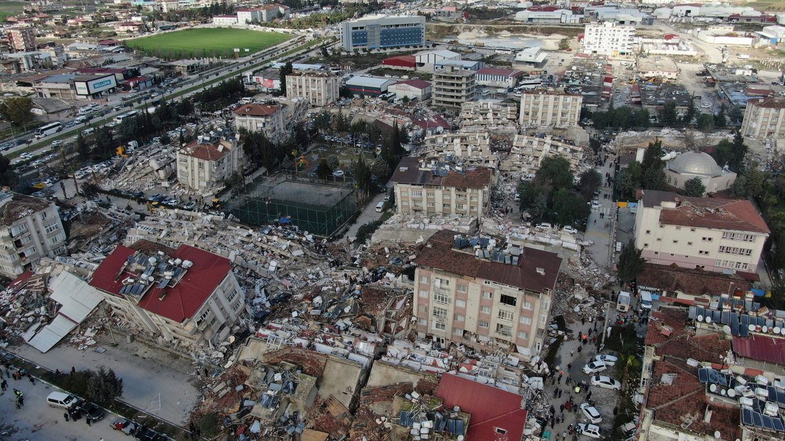 Aerial photo shows the destruction in Hatay city center, southern Turkey, Tuesday, Feb. 7, 2023. Search teams and emergency aid from around the world poured into Turkey and Syria on Tuesday as rescuers working in freezing temperatures dug — sometimes with their bare hands — through the remains of buildings flattened by a magnitude 7.8 earthquake. The death toll soared above 5,000 and was still expected to rise. of collapsed buildings across the region. (IHA via AP) Aerial photo shows the destruction in Hatay city center, southern Turkey, Tuesday, Feb. 7, 2023. Search teams and emergency aid from around the world poured into Turkey and Syria on Tuesday as rescuers working in freezing temperatures dug — sometimes with their bare hands — through the remains of buildings flattened by a magnitude 7.8 earthquake. The death toll soared above 5,000 and was still expected to rise. of collapsed buildings across the region. (IHA via AP)