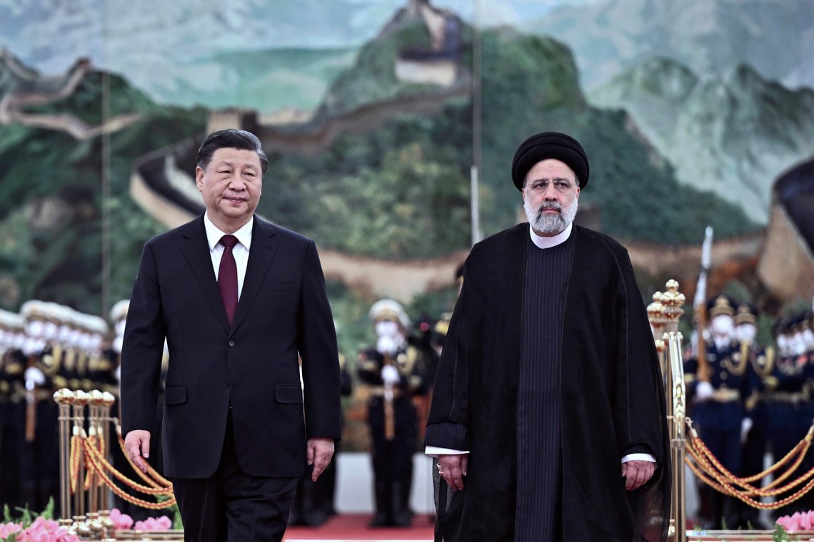In this photo released by Xinhua News Agency, Visiting Iranian President Ebrahim Raisi, right, walks with Chinese President Xi Jinping after reviewing an honor guard during a welcome ceremony at the Great Hall of the People in Beijing, Tuesday, Feb. 14, 2023. Chinese leader Xi Jinping expressed support for Iran during a visit by its president on Tuesday as Tehran tries to expand relations with Beijing and Moscow to offset Western sanctions over its nuclear development. (Yan Yan/Xinhua via AP) In this photo released by Xinhua News Agency, Visiting Iranian President Ebrahim Raisi, right, walks with Chinese President Xi Jinping after reviewing an honor guard during a welcome ceremony at the Great Hall of the People in Beijing, Tuesday, Feb. 14, 2023. Chinese leader Xi Jinping expressed support for Iran during a visit by its president on Tuesday as Tehran tries to expand relations with Beijing and Moscow to offset Western sanctions over its nuclear development. (Yan Yan/Xinhua via AP)