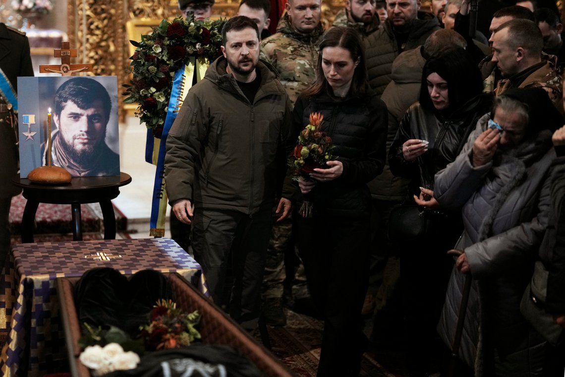 Ukrainian President Volodymyr Zelenskyy and Finland's Prime Minister Sanna Marin attend the funeral of Ukrainian officer Dmytro Kotsiubaylo, code-name "Da Vinci", at the St. Michael's Cathedral, in Kyiv, Ukraine, Friday, March 10, 2023. Kotsiubaylo was killed in a battle near Bakhmut in the Donetsk region three days ago. (AP Photo/Thibault Camus) Ukrainian President Volodymyr Zelenskyy and Finland's Prime Minister Sanna Marin attend the funeral of Ukrainian officer Dmytro Kotsiubaylo, code-name "Da Vinci", at the St. Michael's Cathedral, in Kyiv, Ukraine, Friday, March 10, 2023. Kotsiubaylo was killed in a battle near Bakhmut in the Donetsk region three days ago. (AP Photo/Thibault Camus)