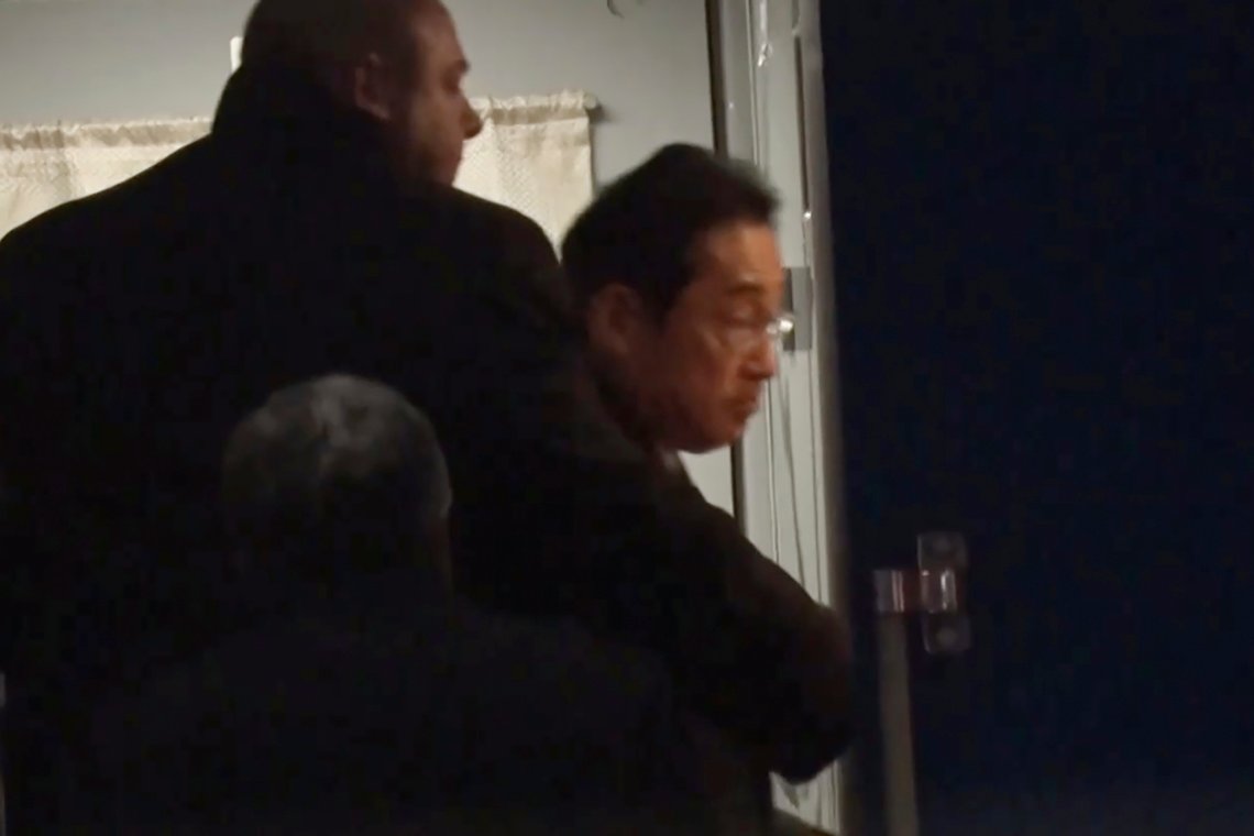 In this image made from video provided by Japan's NTV, Japanese Prime Minister Fumio Kishida gets on train in Przemysl, Poland, early Tuesday, March 21, 2023, heading to Kyiv for talks with Ukrainian President Volodymyr Zelenskyy. Kishida’s surprise trip to Ukraine comes just hours after he met with Indian Prime Minister Narendra Modi in New Delhi. (NTV via AP) In this image made from video provided by Japan's NTV, Japanese Prime Minister Fumio Kishida gets on train in Przemysl, Poland, early Tuesday, March 21, 2023, heading to Kyiv for talks with Ukrainian President Volodymyr Zelenskyy. Kishida’s surprise trip to Ukraine comes just hours after he met with Indian Prime Minister Narendra Modi in New Delhi. (NTV via AP)