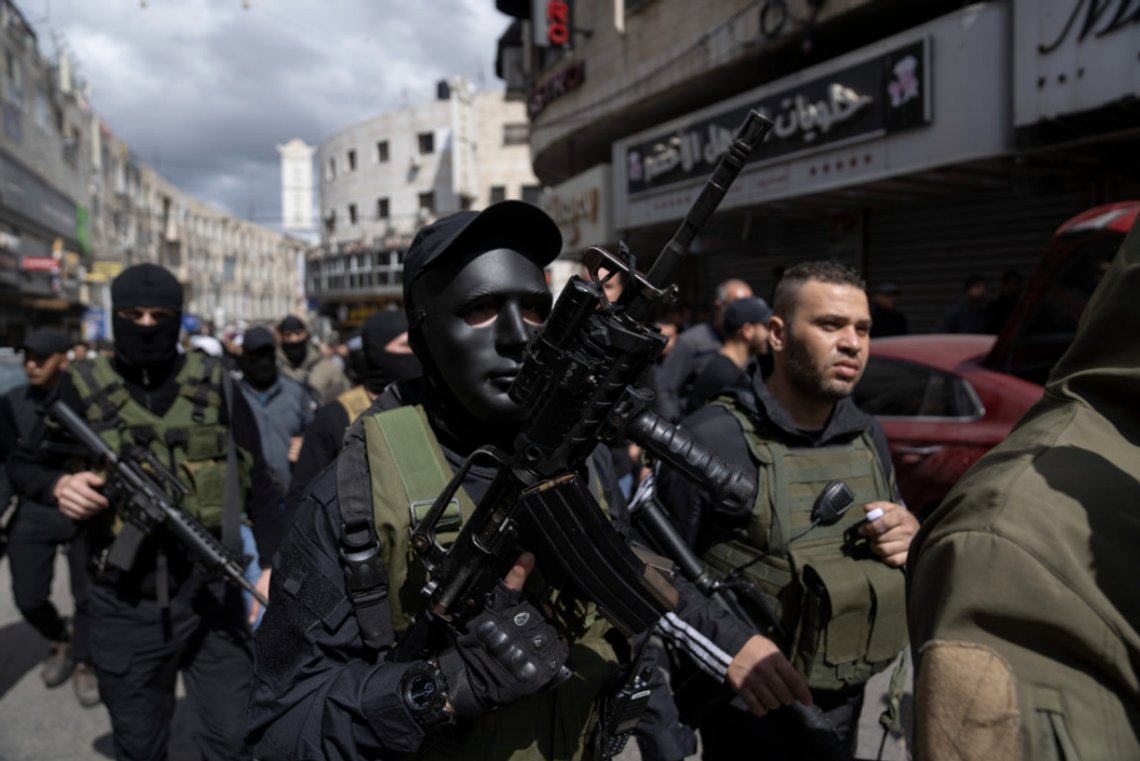 Gunmen take part in the funeral of 5 Palestinians who were killed in an Israeli raid Tuesday, in the West Bank city of Jenin, Wednesday, March 8, 2023. A raid by Israeli security forces into the Jenin refugee camp on Tuesday aimed at arresting a suspect in the fatal shooting of two Israeli brothers last month sparked a firefight that killed six Palestinians and wounded over two dozen others. (AP Photo/Nasser Nasser) Gunmen take part in the funeral of 5 Palestinians who were killed in an Israeli raid Tuesday, in the West Bank city of Jenin, Wednesday, March 8, 2023. A raid by Israeli security forces into the Jenin refugee camp on Tuesday aimed at arresting a suspect in the fatal shooting of two Israeli brothers last month sparked a firefight that killed six Palestinians and wounded over two dozen others. (AP Photo/Nasser Nasser)