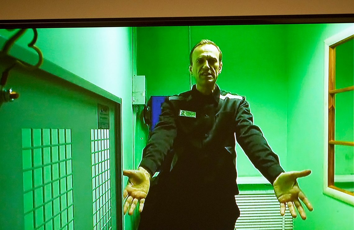 FILE - Russian opposition leader Alexei Navalny is seen on a TV screen, as he appears in a video link provided by the Russian Federal Penitentiary Service in a courtroom of the Second Cassation Court of General Jurisdiction in Moscow, Russia, on Oct. 18, 2022. Imprisoned Russian opposition leader Alexei Navalny learned Monday March 13, 2023 from his lawyer that a film detailing his poisoning and political activism won the Oscar for best documentary feature. (AP Photo/Alexander Zemlianichenko, File) FILE - Russian opposition leader Alexei Navalny is seen on a TV screen, as he appears in a video link provided by the Russian Federal Penitentiary Service in a courtroom of the Second Cassation Court of General Jurisdiction in Moscow, Russia, on Oct. 18, 2022. Imprisoned Russian opposition leader Alexei Navalny learned Monday March 13, 2023 from his lawyer that a film detailing his poisoning and political activism won the Oscar for best documentary feature. (AP Photo/Alexander Zemlianichenko, File)