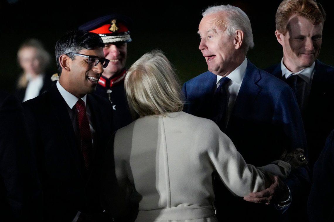 President Joe Biden is greeted by British Prime Minister Rishi Sunak, left, and US Ambassador to the United Kingdom Jane Hartley, center, he steps off Air Force One at Belfast International Airport in Belfast, Northern Ireland, Tuesday, April 11, 2023. Biden is visiting the United Kingdom and Ireland in part to help celebrate the 25th anniversary of the Good Friday Agreement. At right is United States Special Envoy for Northern Ireland Joe Kennedy III. (AP Photo/Patrick Semansky) President Joe Biden is greeted by British Prime Minister Rishi Sunak, left, and US Ambassador to the United Kingdom Jane Hartley, center, he steps off Air Force One at Belfast International Airport in Belfast, Northern Ireland, Tuesday, April 11, 2023. Biden is visiting the United Kingdom and Ireland in part to help celebrate the 25th anniversary of the Good Friday Agreement. At right is United States Special Envoy for Northern Ireland Joe Kennedy III. (AP Photo/Patrick Semansky)