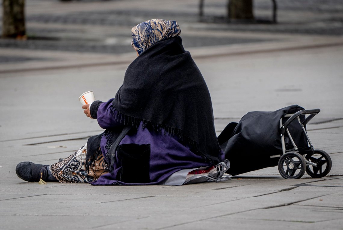 A woman begs in the main shopping street in Frankfurt, Germany, Thursday, Oct. 13, 2022. (AP Photo/Michael Probst) A woman begs in the main shopping street in Frankfurt, Germany, Thursday, Oct. 13, 2022. (AP Photo/Michael Probst)
