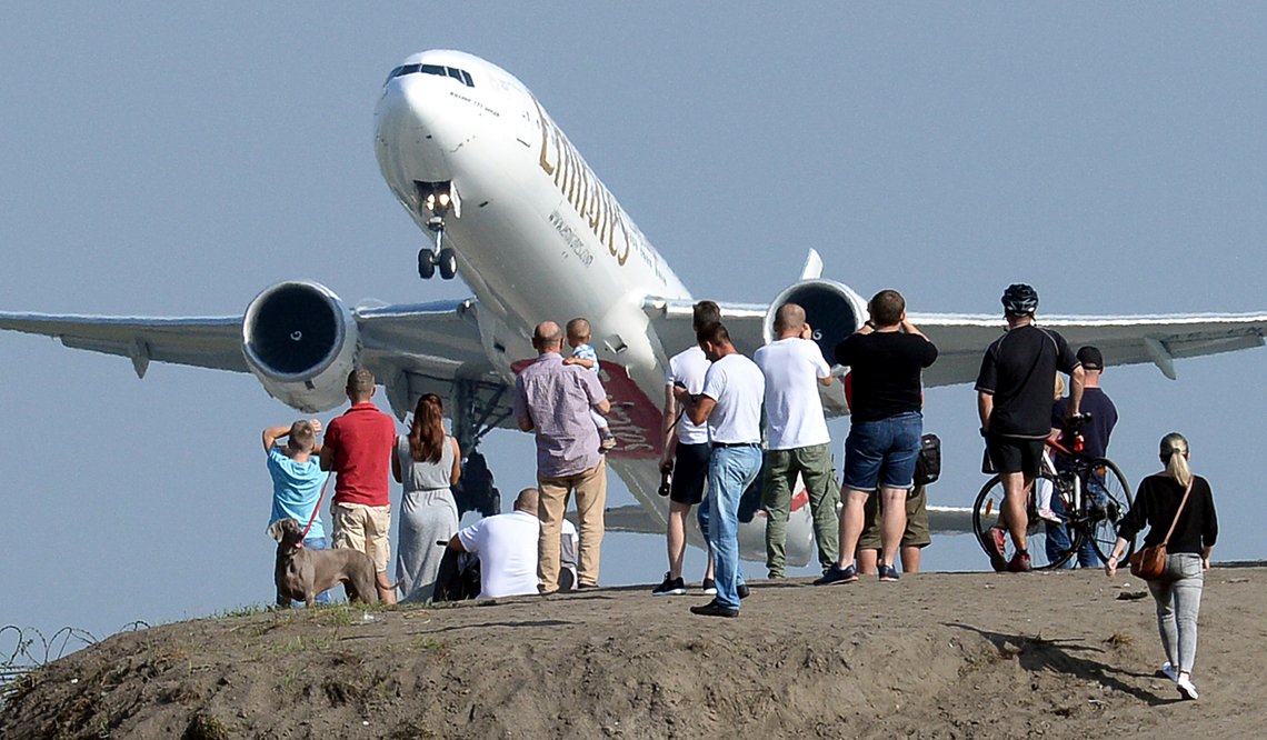 People gather on a hill near the Chopin Airport to watch aeroplanes taking off, in Warsaw, Poland, Sunday, Sept. 9, 2018. (AP Photo/Alik Keplicz) People gather on a hill near the Chopin Airport to watch aeroplanes taking off, in Warsaw, Poland, Sunday, Sept. 9, 2018. (AP Photo/Alik Keplicz)