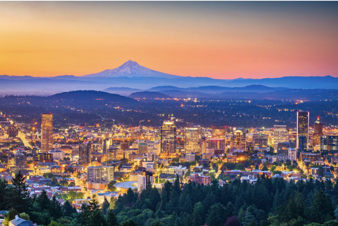 Portland, Oregon, USA skyline at dusk with Mt. Hood in the distance. Photo> Shutterstock, Sean Pavone, United States. Portland, Oregon, USA skyline at dusk with Mt. Hood in the distance. Photo> Shutterstock, Sean Pavone, United States.
