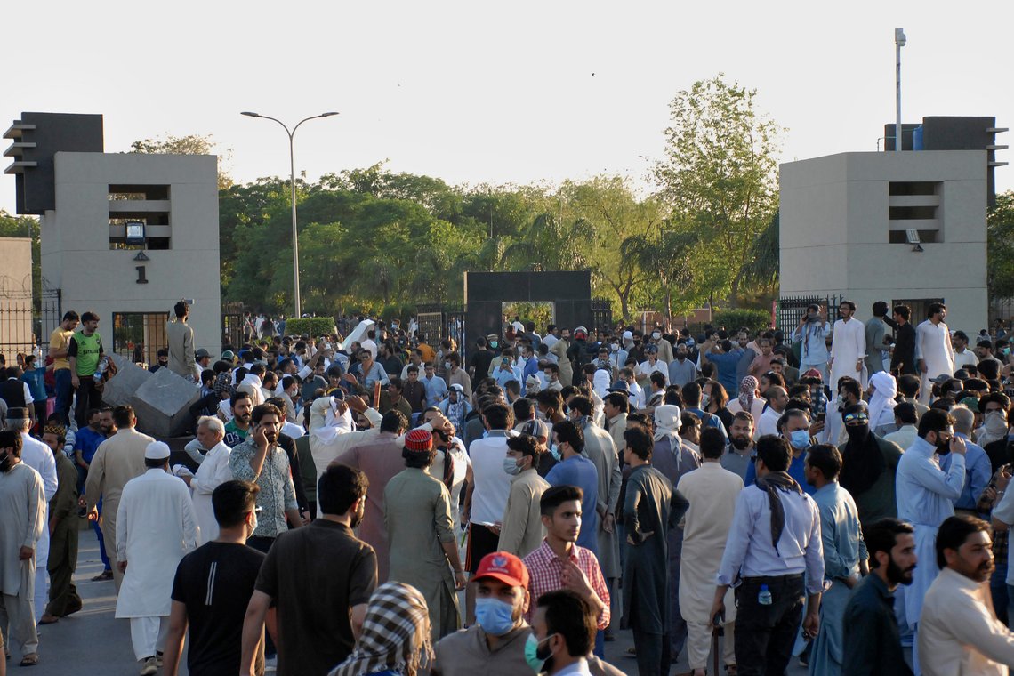 Supporters of Pakistan's former Prime Minister Imran Khan block an entry gate of the Pakistani army's headquarters during a protest protest against the arrest of their leader, in Rawalpindi, Pakistan, Tuesday, May 9, 2023. Khan was arrested Tuesday as he appeared in a court in the country’s capital, Islamabad, to face charges in multiple graft cases. Security agents dragged Khan outside and shoved him into an armored car before whisking him away. (AP Photo/Khurram Butt) Supporters of Pakistan's former Prime Minister Imran Khan block an entry gate of the Pakistani army's headquarters during a protest protest against the arrest of their leader, in Rawalpindi, Pakistan, Tuesday, May 9, 2023. Khan was arrested Tuesday as he appeared in a court in the country’s capital, Islamabad, to face charges in multiple graft cases. Security agents dragged Khan outside and shoved him into an armored car before whisking him away. (AP Photo/Khurram Butt)