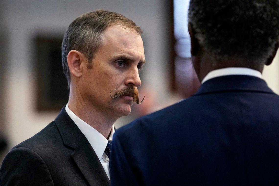Rep. Andrew Murr, R-Junction, chair of the House General Investigating Committee, left, talks with Texas Rep. Harold Dutton Jr., D-Houston, right, during impeachment proceedings against state Attorney General Ken Paxton in the House Chamber at the Texas Capitol in Austin, Texas, Saturday, May 27, 2023. Texas lawmakers have issued 20 articles of impeachment against Paxton, ranging from bribery to abuse of public trust as state Republicans surged toward a swift and sudden vote that could remove him from office. (AP Photo/Eric Gay) Rep. Andrew Murr, R-Junction, chair of the House General Investigating Committee, left, talks with Texas Rep. Harold Dutton Jr., D-Houston, right, during impeachment proceedings against state Attorney General Ken Paxton in the House Chamber at the Texas Capitol in Austin, Texas, Saturday, May 27, 2023. Texas lawmakers have issued 20 articles of impeachment against Paxton, ranging from bribery to abuse of public trust as state Republicans surged toward a swift and sudden vote that could remove him from office. (AP Photo/Eric Gay)