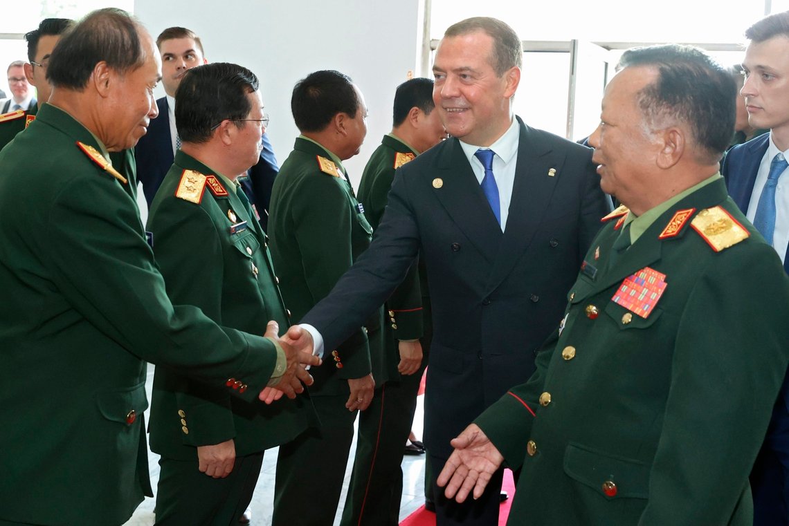 Russian Security Council Deputy Chairman and the head of the United Russia party Dmitry Medvedev, second right, and Laos' Deputy Minister of Defense, Lieutenant General Chansamone Chanyalath, right, shake hands with high level Laos' officers during their meeting in Vientiane, Laos, Tuesday, May 23, 2023. (Ekaterina Shtukina, Sputnik Pool Photo via AP) Russian Security Council Deputy Chairman and the head of the United Russia party Dmitry Medvedev, second right, and Laos' Deputy Minister of Defense, Lieutenant General Chansamone Chanyalath, right, shake hands with high level Laos' officers during their meeting in Vientiane, Laos, Tuesday, May 23, 2023. (Ekaterina Shtukina, Sputnik Pool Photo via AP)
