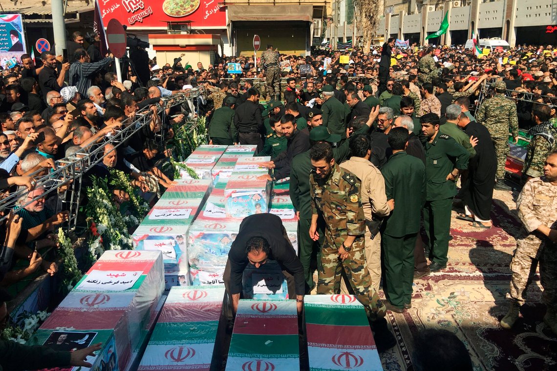 FILE - Caskets of those who died in a terror attack on a military parade in Iran are displayed in Ahvaz, Iran, Sept. 24, 2018. Iran hanged a man who was allegedly behind an attack that killed dozens of people at a military parade in the southern province of Khuzestan in 2018, state media reported on Saturday, May 6, 2023. (AP Photo/Ebrahim Noroozi, File) FILE - Caskets of those who died in a terror attack on a military parade in Iran are displayed in Ahvaz, Iran, Sept. 24, 2018. Iran hanged a man who was allegedly behind an attack that killed dozens of people at a military parade in the southern province of Khuzestan in 2018, state media reported on Saturday, May 6, 2023. (AP Photo/Ebrahim Noroozi, File)