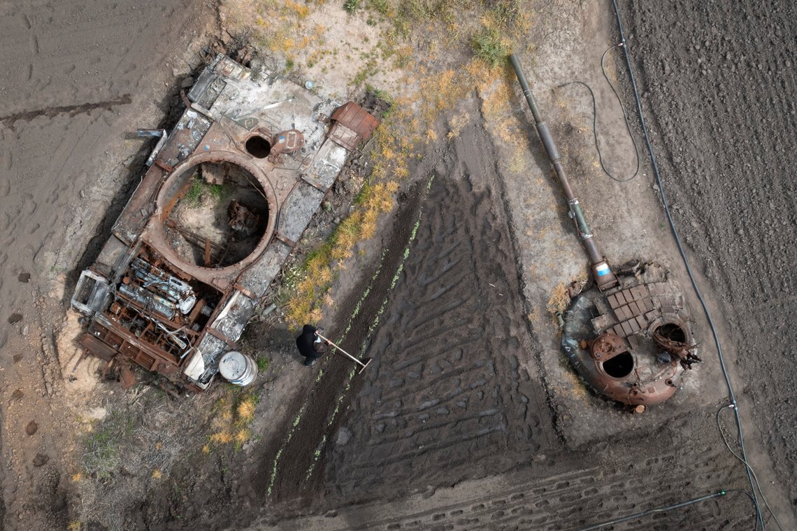 A man plants sunflowers in his garden near a damaged Russian tank and its turret in the village of Velyka Dymerka, Kyiv region, Ukraine, Wednesday, May 17, 2023. (AP Photo/Efrem Lukatsky) A man plants sunflowers in his garden near a damaged Russian tank and its turret in the village of Velyka Dymerka, Kyiv region, Ukraine, Wednesday, May 17, 2023. (AP Photo/Efrem Lukatsky)