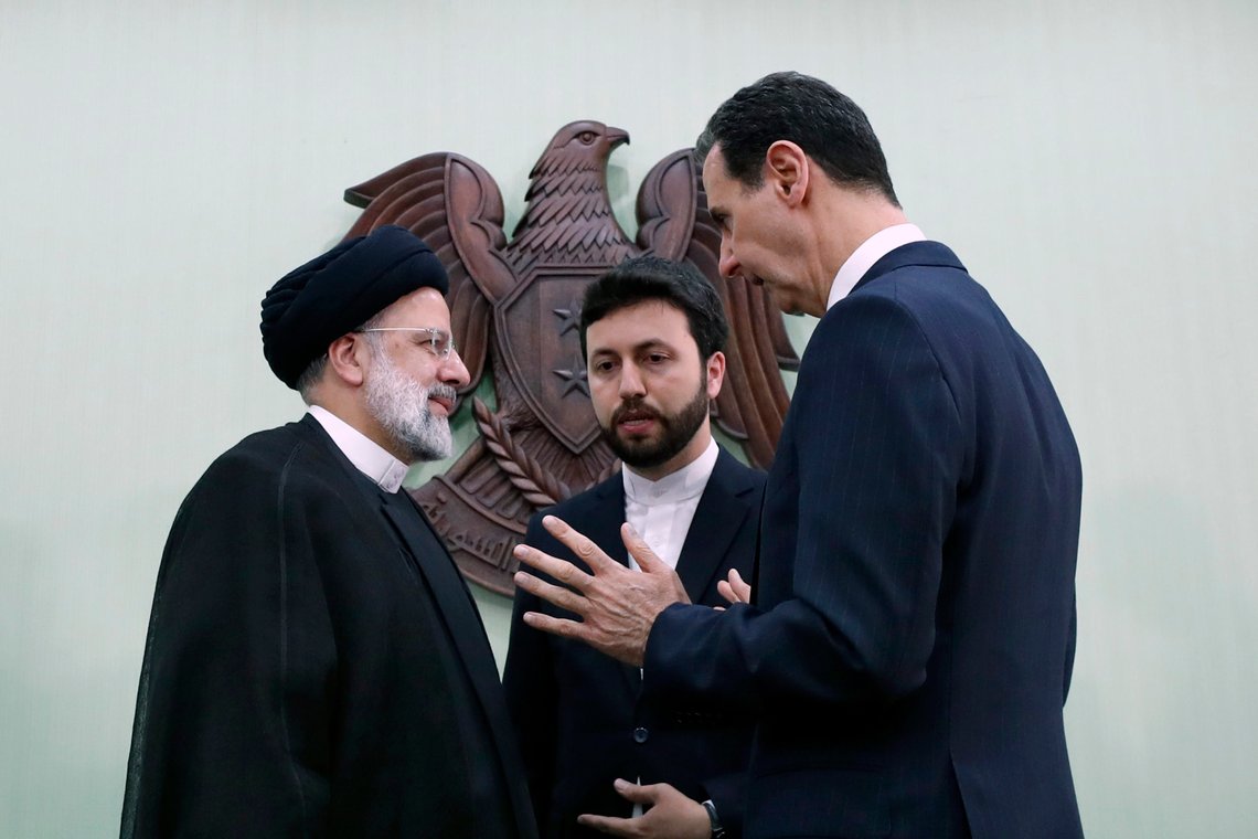 Syrian President Bashar Assad, right, speaks with Iranian President Ebrahim Raisi, left, in Damascus, Syria, Wednesday, May 3, 2023. Raisi Wednesday met Assad in Damascus in a bid to boost cooperation between the two allies, state media reported. (AP Photo/Omar Sanadiki) Syrian President Bashar Assad, right, speaks with Iranian President Ebrahim Raisi, left, in Damascus, Syria, Wednesday, May 3, 2023. Raisi Wednesday met Assad in Damascus in a bid to boost cooperation between the two allies, state media reported. (AP Photo/Omar Sanadiki)