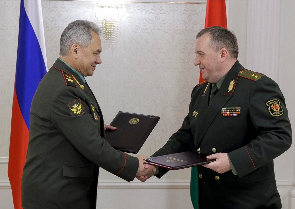 Russian Defense Minister Sergei Shoigu, left, and Belarusian Defense Minister Viktor Khrenin exchange documents during a meeting after a session of the Council of Defense Ministers of the Collective Security Treaty Organization (CSTO) in Minsk, Belarus, Thursday, May 25, 2023. (Vadim Savitsky/Russian Defense Ministry Press Service via AP) Russian Defense Minister Sergei Shoigu, left, and Belarusian Defense Minister Viktor Khrenin exchange documents during a meeting after a session of the Council of Defense Ministers of the Collective Security Treaty Organization (CSTO) in Minsk, Belarus, Thursday, May 25, 2023. (Vadim Savitsky/Russian Defense Ministry Press Service via AP)