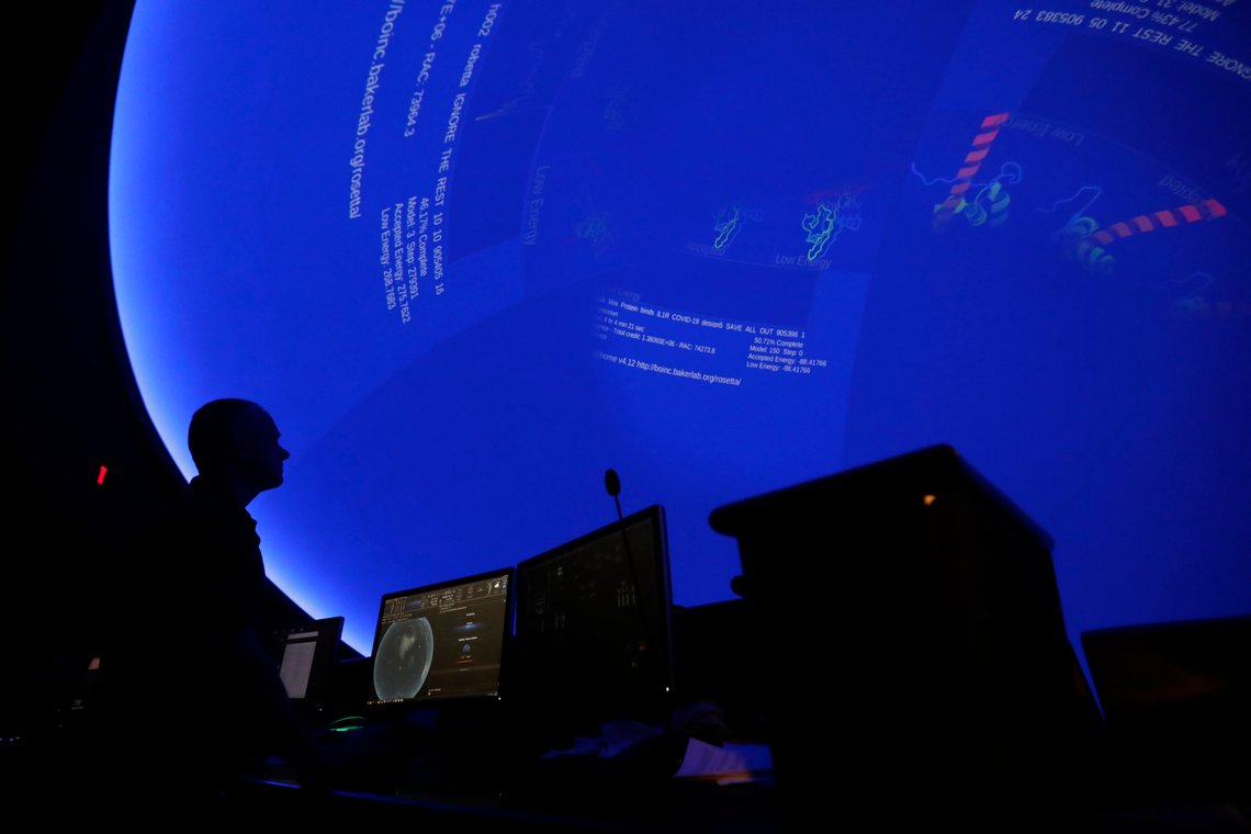 Brooks Weisblat, vice president of technology at the the Phillip and Patricia Frost Museum of Science, displays data related to the new coronavirus pandemic in the planetarium of the museum, Tuesday, April 7, 2020, in Miami. The museum is contributing to global scientific research efforts to fight diseases such as COVID-19, by enabling use of its computer servers through a platform run by the University of California, Berkeley, with support of the National Science Foundation. The project is looking to accurately model important coronavirus proteins and predict their three-dimensional shapes. (AP Photo/Lynne Sladky) Brooks Weisblat, vice president of technology at the the Phillip and Patricia Frost Museum of Science, displays data related to the new coronavirus pandemic in the planetarium of the museum, Tuesday, April 7, 2020, in Miami. The museum is contributing to global scientific research efforts to fight diseases such as COVID-19, by enabling use of its computer servers through a platform run by the University of California, Berkeley, with support of the National Science Foundation. The project is looking to accurately model important coronavirus proteins and predict their three-dimensional shapes. (AP Photo/Lynne Sladky)