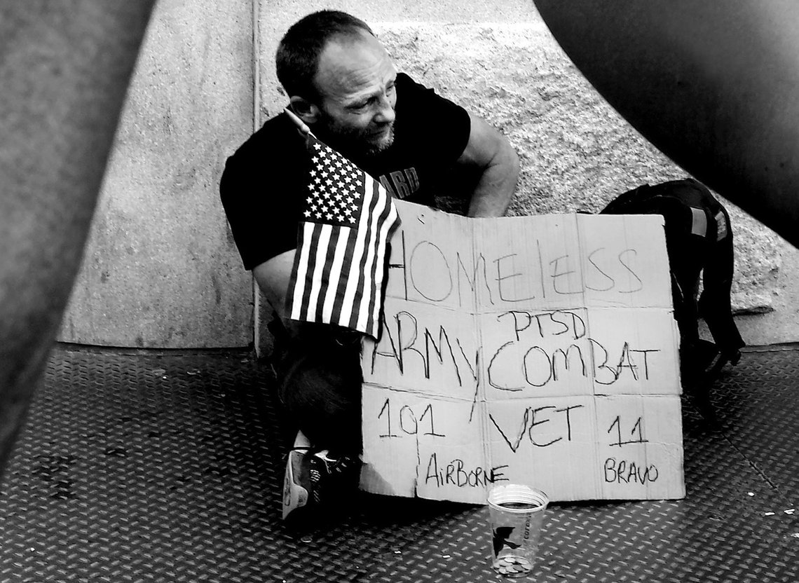 NEW YORK, NY-JULY 2018: A homeless veteran looks for help on a sidewalk in the Soho section of Manhattan. Photo: Shutterstock by Joe Tabacca. United States. NEW YORK, NY-JULY 2018: A homeless veteran looks for help on a sidewalk in the Soho section of Manhattan. Photo: Shutterstock by Joe Tabacca. United States.