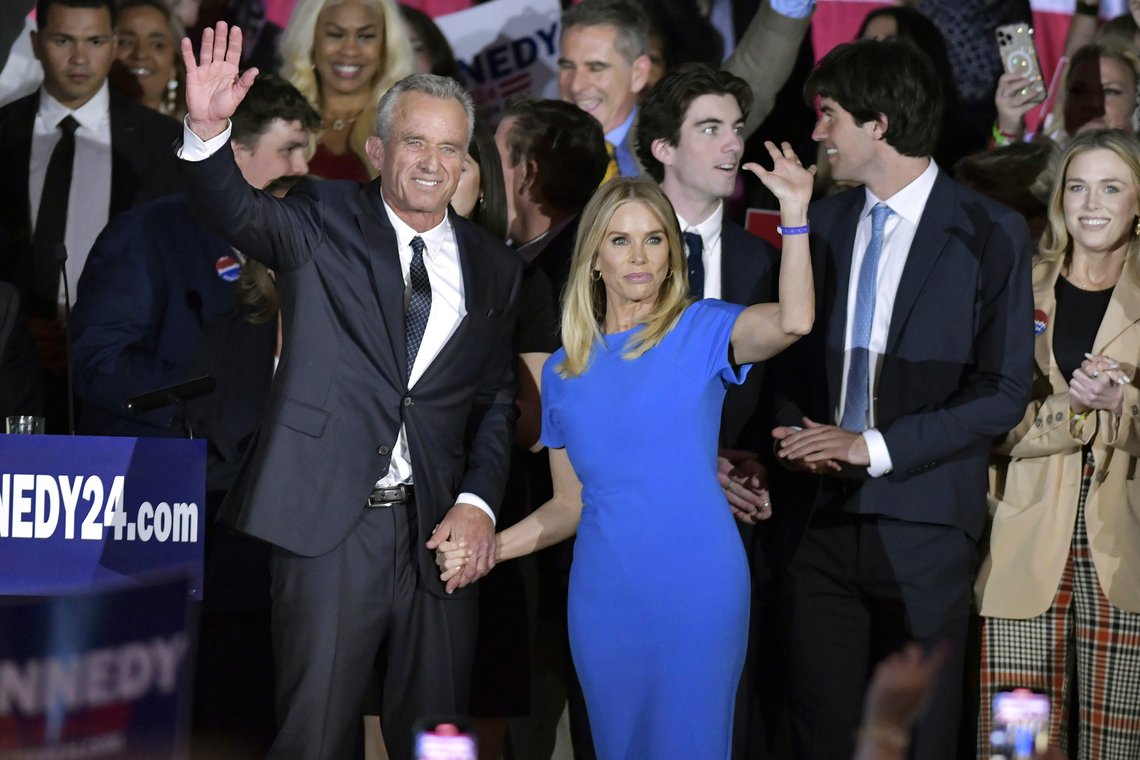 Robert F. Kennedy Jr. and wife Cheryl Hines wave with family members onstage at an event where announced his run for president on Wednesday, April 19, 2023, at the Boston Park Plaza Hotel, in Boston. (AP Photo/Josh Reynolds) Robert F. Kennedy Jr. and wife Cheryl Hines wave with family members onstage at an event where announced his run for president on Wednesday, April 19, 2023, at the Boston Park Plaza Hotel, in Boston. (AP Photo/Josh Reynolds)