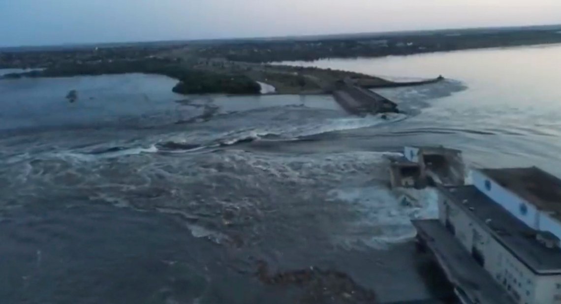 In this image taken from video released by the Ukrainian Presidential Office, water runs through a breakthrough in the Kakhovka dam in Kakhovka, Ukraine, Tuesday, June 6, 2023. Ukraine on Tuesday accused Russian forces of blowing up the major dam and hydroelectric power station in a part of southern Ukraine they control, threatening a massive flood that could displace hundreds of thousands of people, and ordered residents downriver to evacuate. (Ukrainian Presidential Office via AP) In this image taken from video released by the Ukrainian Presidential Office, water runs through a breakthrough in the Kakhovka dam in Kakhovka, Ukraine, Tuesday, June 6, 2023. Ukraine on Tuesday accused Russian forces of blowing up the major dam and hydroelectric power station in a part of southern Ukraine they control, threatening a massive flood that could displace hundreds of thousands of people, and ordered residents downriver to evacuate. (Ukrainian Presidential Office via AP)