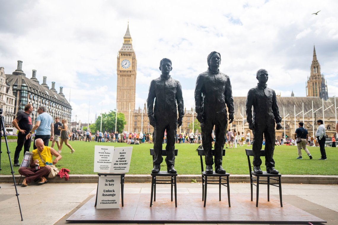 A sculpture called Anything To Say, which features life-sized bronze figures of whistleblowers, from left, Edward Snowden, Julian Assange and Chelsea Manning, each standing on their own individual chair, is unveiled at Parliament Square, London, Saturday June 24, 2023 during a protest to step up demands for the release from prison of WikiLeaks founder Julian Assange. (James Manning/PA via AP) A sculpture called Anything To Say, which features life-sized bronze figures of whistleblowers, from left, Edward Snowden, Julian Assange and Chelsea Manning, each standing on their own individual chair, is unveiled at Parliament Square, London, Saturday June 24, 2023 during a protest to step up demands for the release from prison of WikiLeaks founder Julian Assange. (James Manning/PA via AP)
