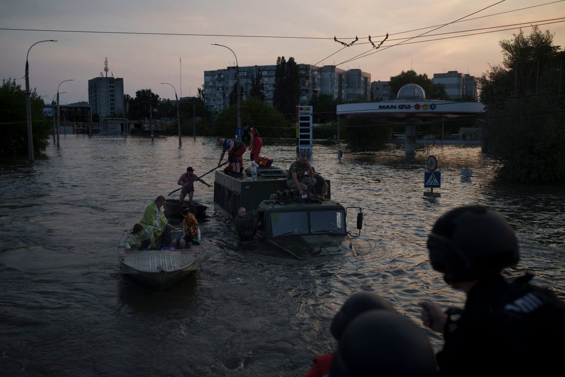 Residents are evacuated from a flooded neighborhood in Kherson, Ukraine, Tuesday, June 6, 2023. A major dam in southern Ukraine has collapsed, flooding villages, endangering crops in the country's breadbasket and threatening drinking water supplies. (AP Photo/Felipe Dana) Residents are evacuated from a flooded neighborhood in Kherson, Ukraine, Tuesday, June 6, 2023. A major dam in southern Ukraine has collapsed, flooding villages, endangering crops in the country's breadbasket and threatening drinking water supplies. (AP Photo/Felipe Dana)
