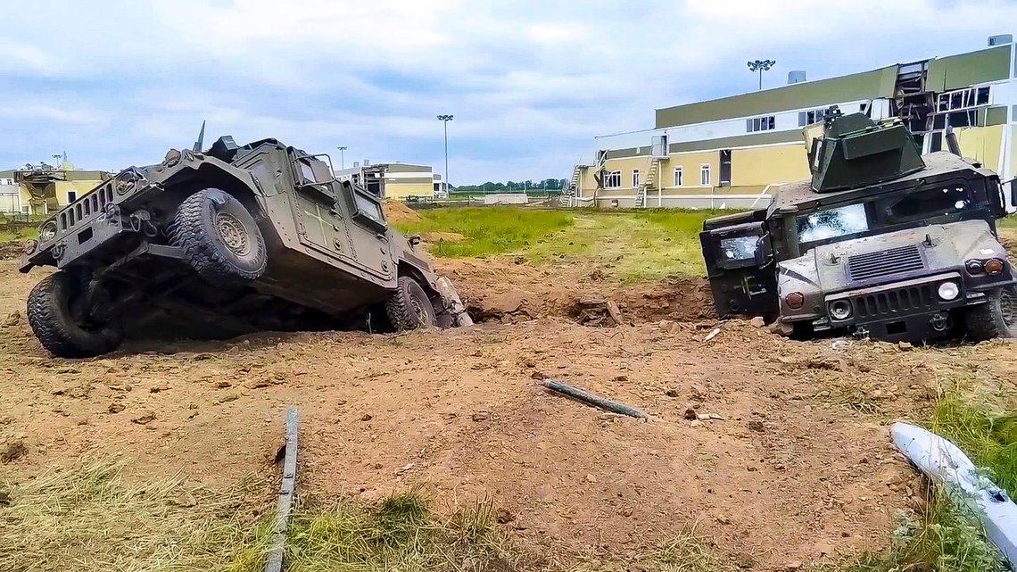 In this image taken from video released by Russian Defense Ministry Press Service, damaged armored military vehicles are seen after fighting in Russia's western Belgorod region on Tuesday, May 23, 2023. Russia alleges that dozens of Ukrainian militants crossed into one of its border towns in its Belgorod region, striking targets and forcing an evacuation, before over 70 of the attackers were killed or pushed back by a counterterrorism operation. (Russian Defense Ministry Press Service via AP) In this image taken from video released by Russian Defense Ministry Press Service, damaged armored military vehicles are seen after fighting in Russia's western Belgorod region on Tuesday, May 23, 2023. Russia alleges that dozens of Ukrainian militants crossed into one of its border towns in its Belgorod region, striking targets and forcing an evacuation, before over 70 of the attackers were killed or pushed back by a counterterrorism operation. (Russian Defense Ministry Press Service via AP)
