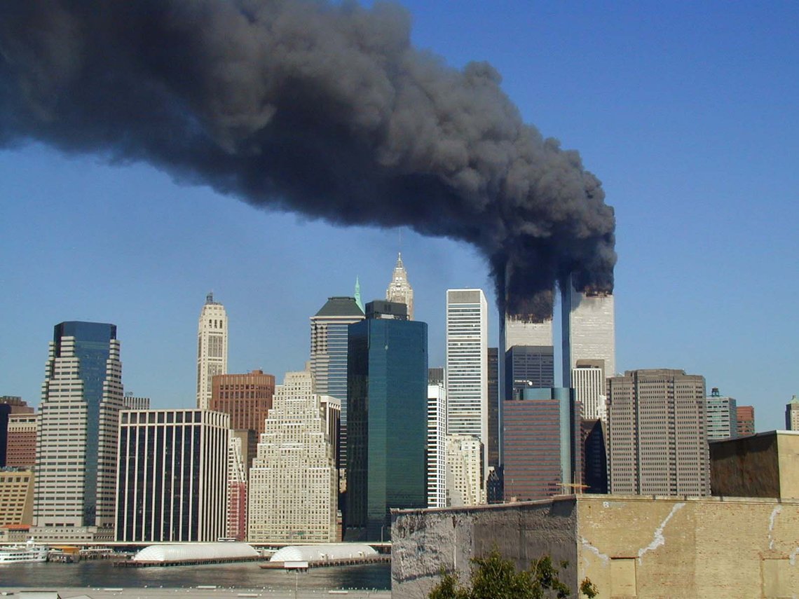 Plumes of smoke billow from the World Trade Center towers in Lower Manhattan, New York City, after a Boeing 767 hits each tower during the September 11 attacks. Photo by Michael Foran. Wikepedia. Plumes of smoke billow from the World Trade Center towers in Lower Manhattan, New York City, after a Boeing 767 hits each tower during the September 11 attacks. Photo by Michael Foran. Wikepedia.