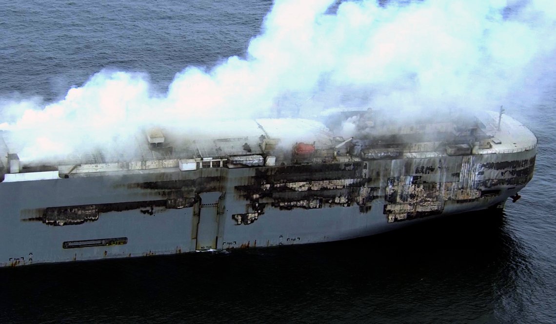 Smoke is seen from a freight ship in the North Sea, about 27 kilometers (17 miles) north of the Dutch island of Ameland, Friday, July 28, 2023. Salvage crews were waiting Friday for a chance to board a cargo ship loaded with cars that has been burning for more than two days off the northern Dutch coast. (Kustwacht Nederland/Coast Guard Netherlands via AP) Smoke is seen from a freight ship in the North Sea, about 27 kilometers (17 miles) north of the Dutch island of Ameland, Friday, July 28, 2023. Salvage crews were waiting Friday for a chance to board a cargo ship loaded with cars that has been burning for more than two days off the northern Dutch coast. (Kustwacht Nederland/Coast Guard Netherlands via AP)